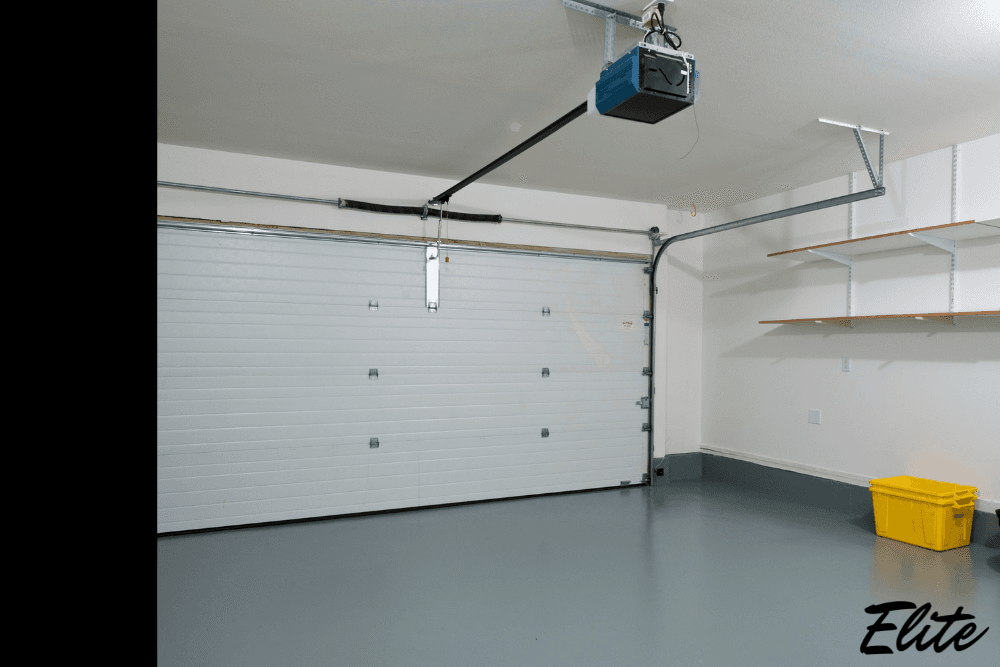 Interior garage view with overhead door and opener system, illustrating garage door parts and motor setup.