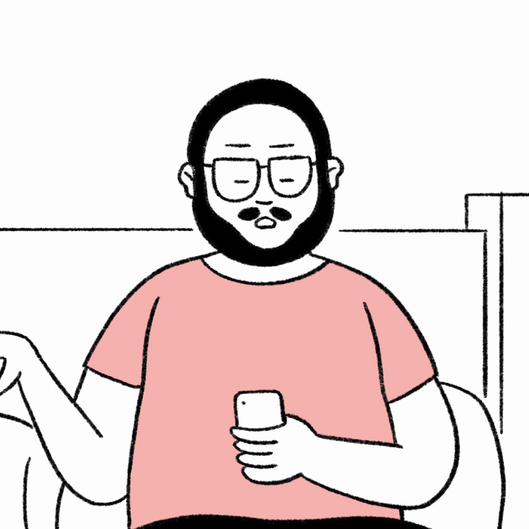 Pink coneflowers bloom in front of historic buildings.