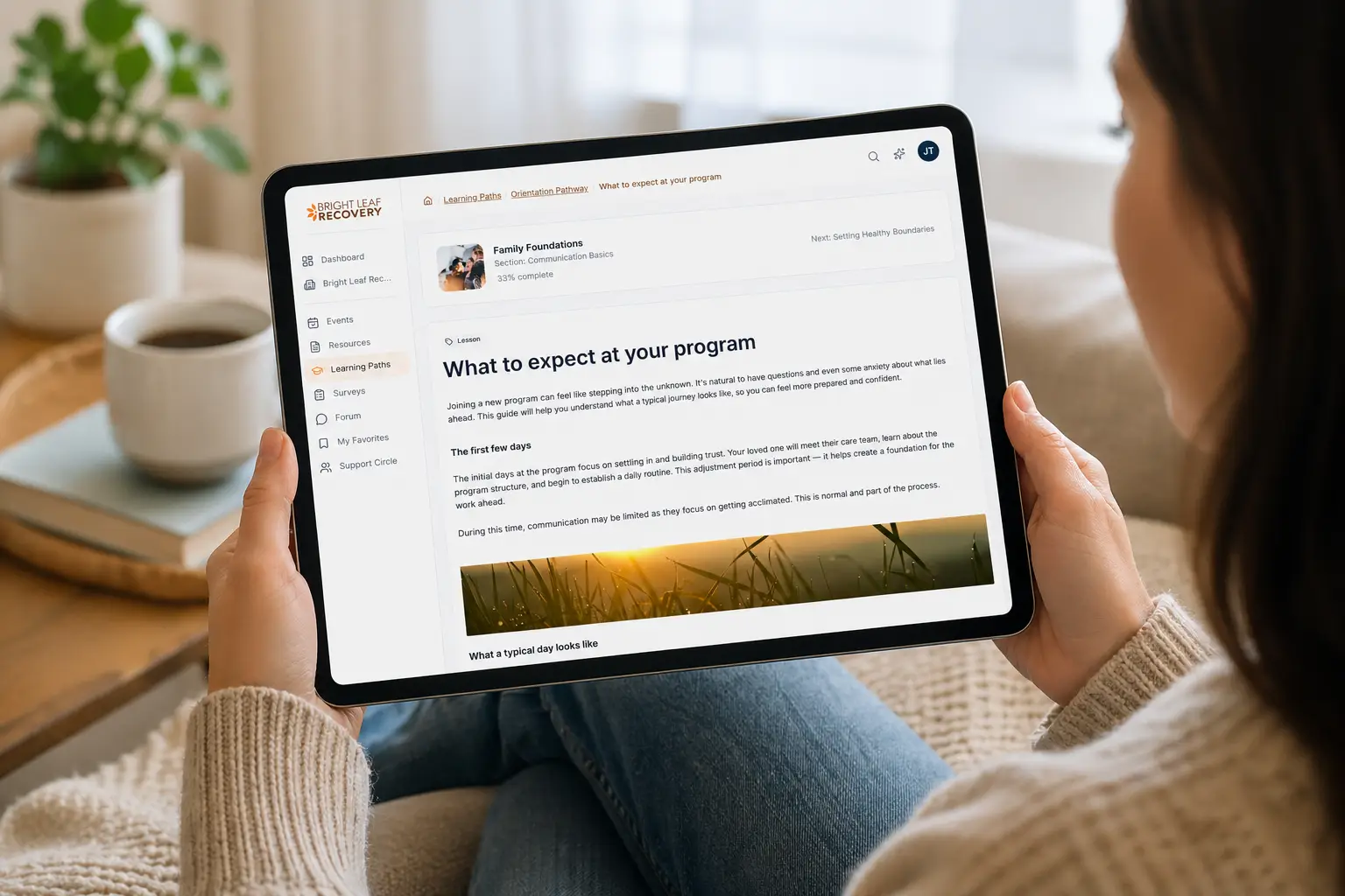 Woman looking at a Pathroot resource article on a tablet
