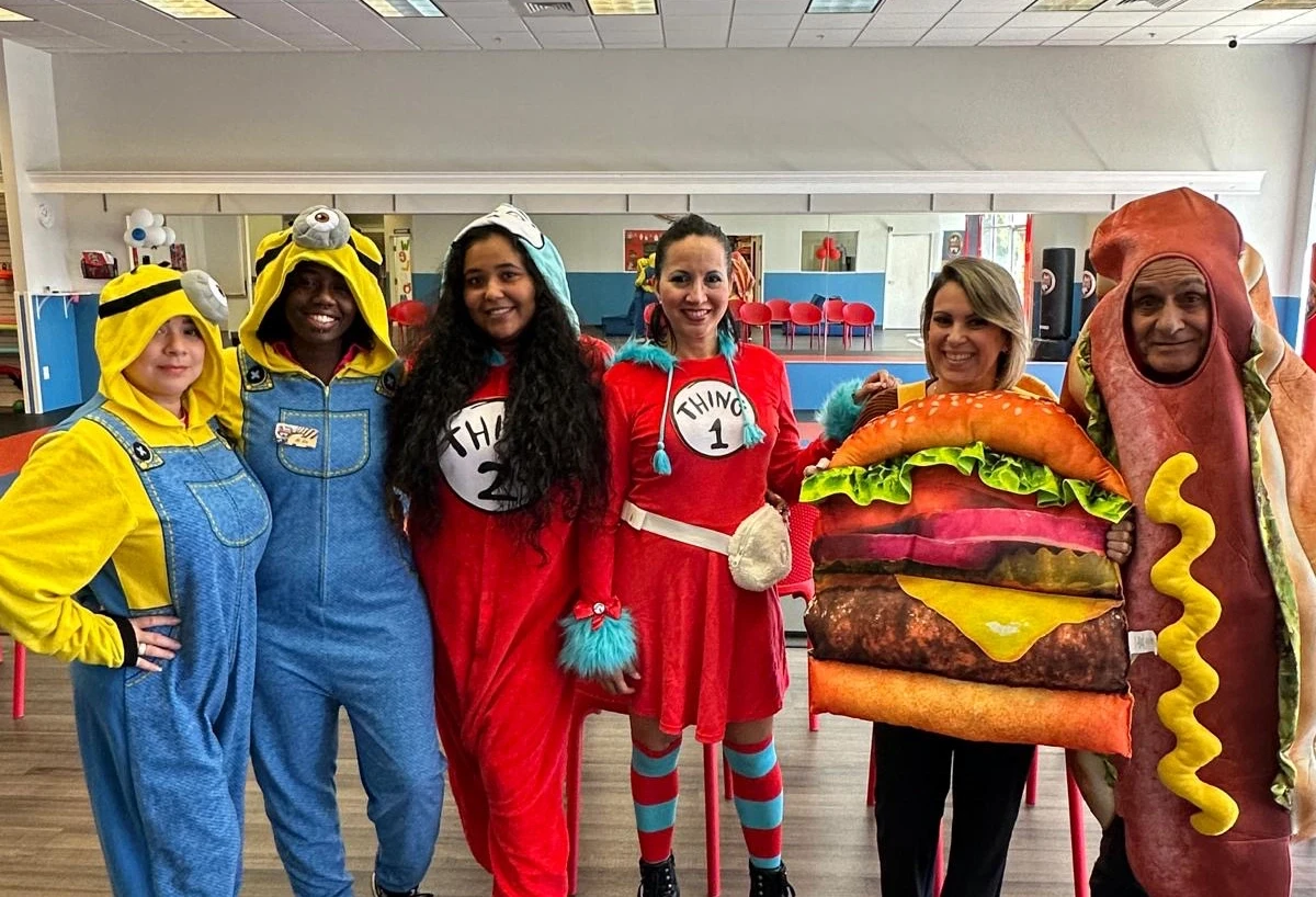 Team members dressed in different halloween costumes.
