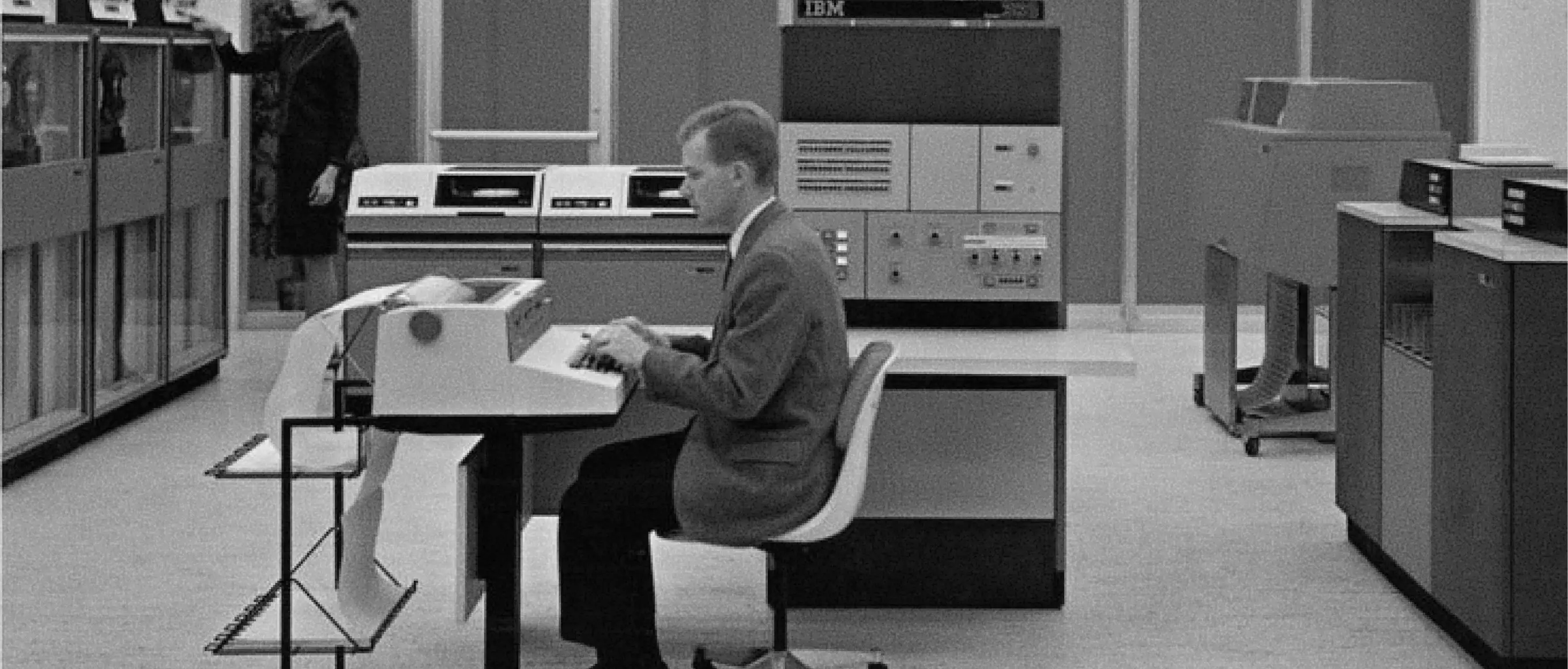 Retro image of a man sitting at a computer desk