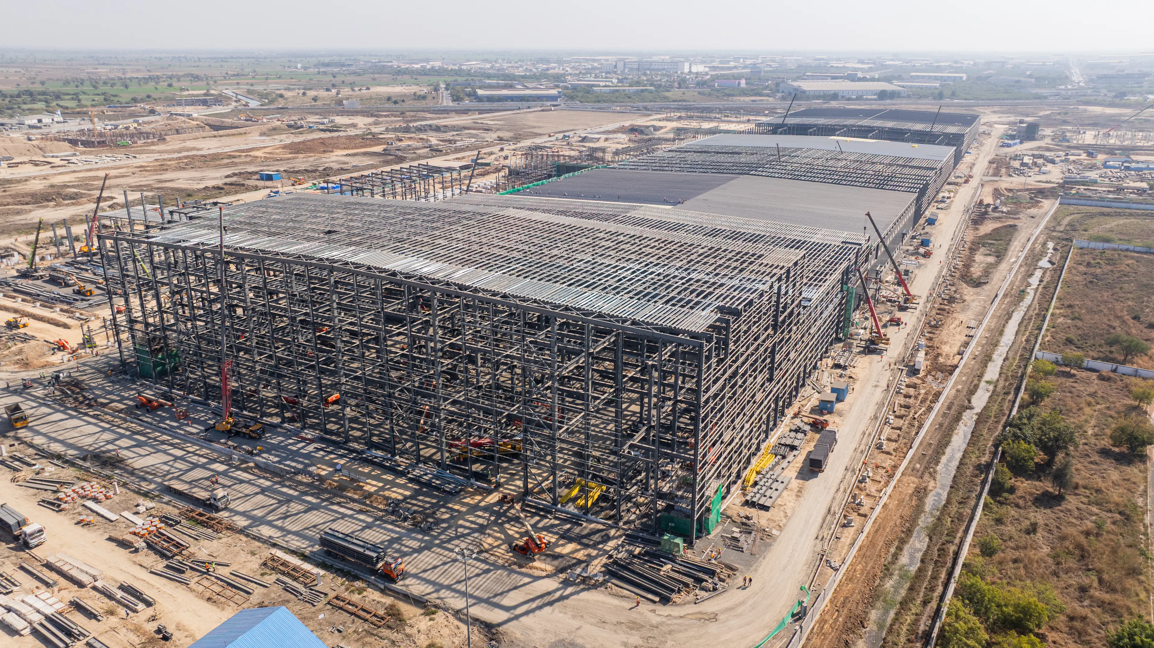 Large construction site with steel frames and cranes near Bridgwater.