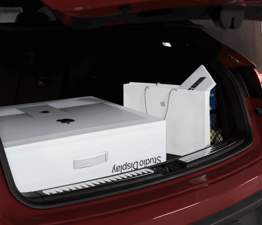 Equipment boxes loaded into the back of a car