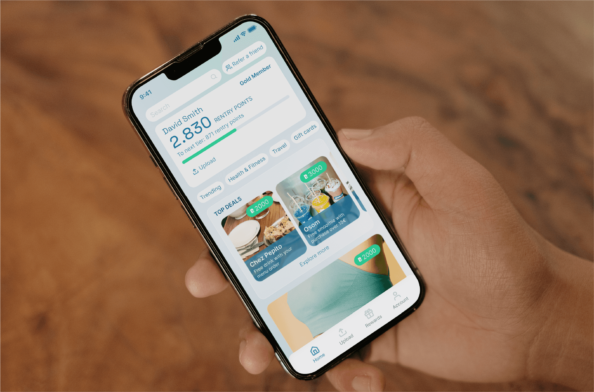 Hand holding a phone with the Rentry mobile app - home screen