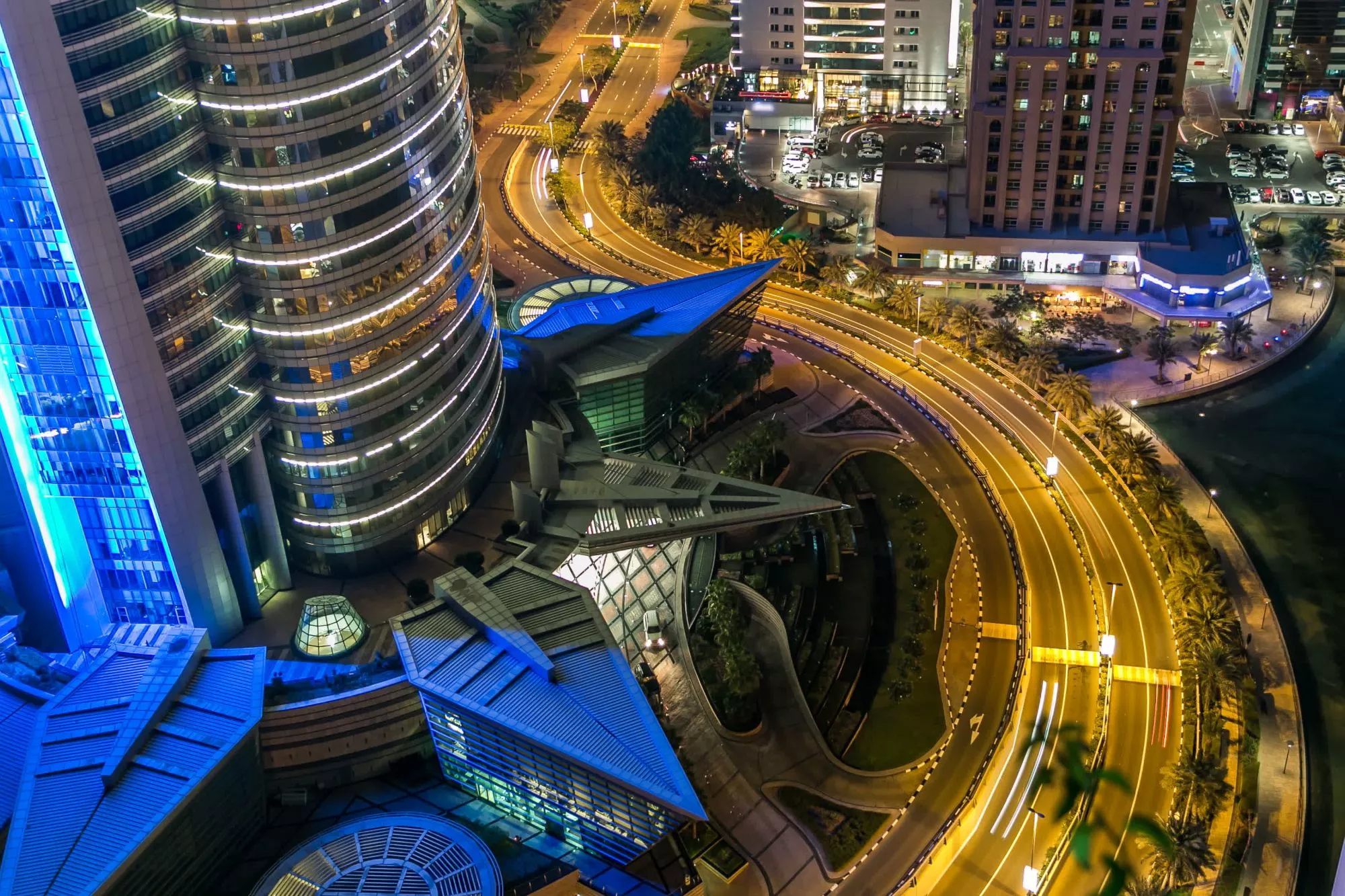 Aerial night view of Almas Towers Dubai, showcasing prime property opportunities in JLT.