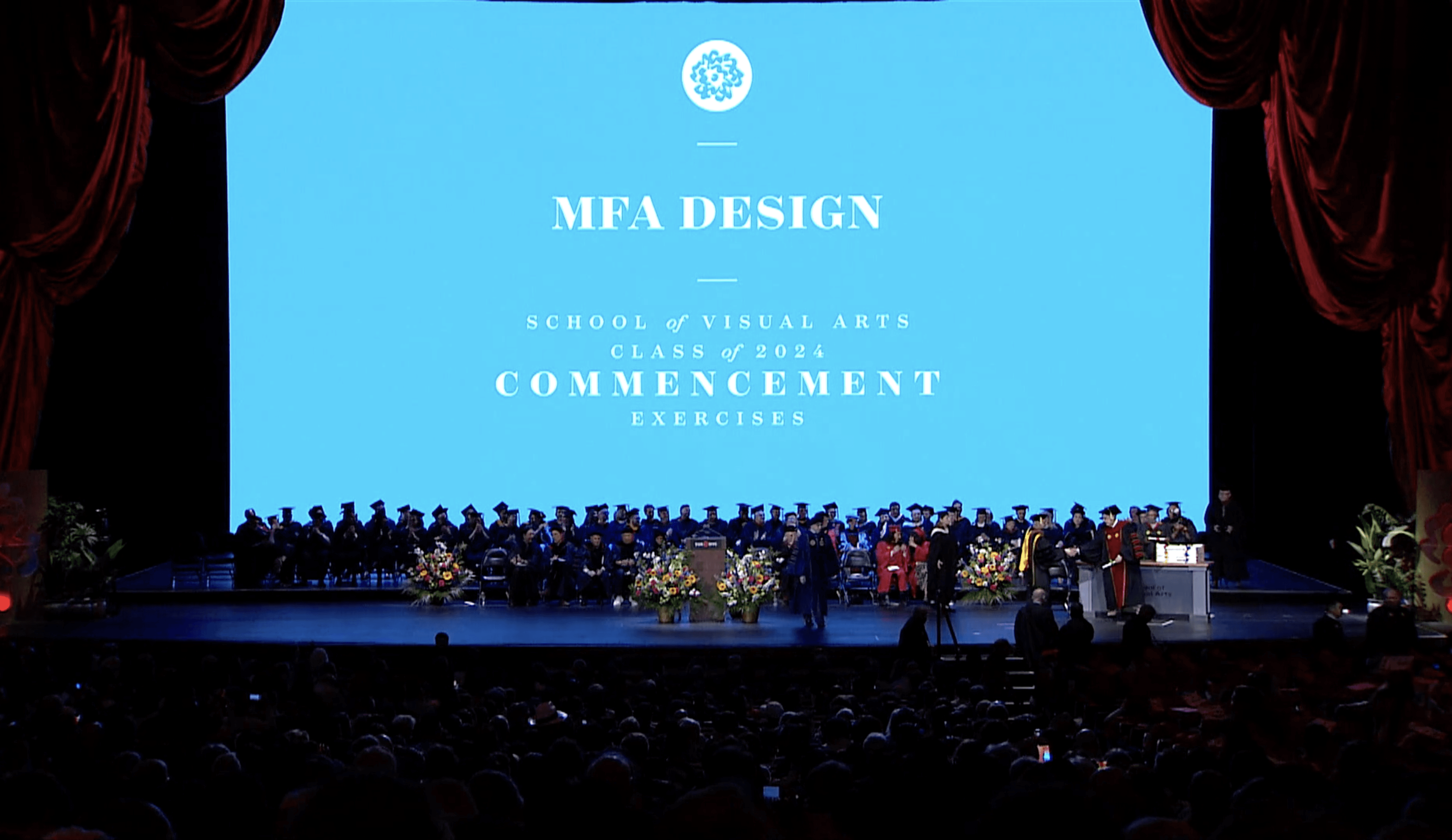 The stage of Carnegie Hall with the MFAD logo
