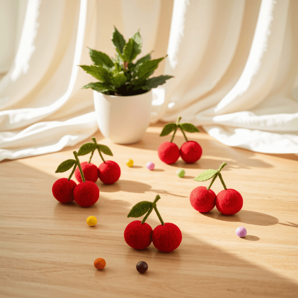 product photography of a set of cherry-shaped felt decorations