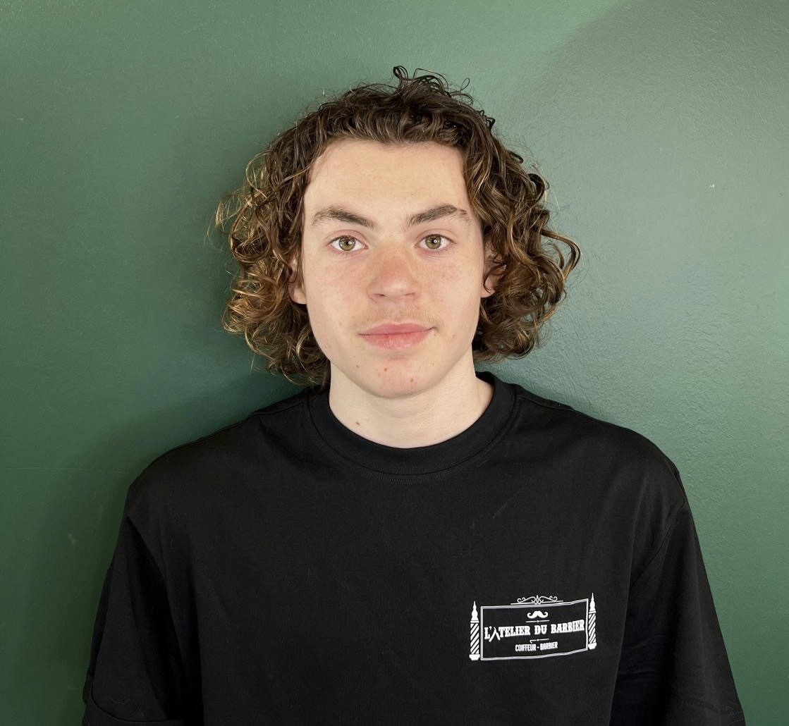 man wearing black crew-neck shirt