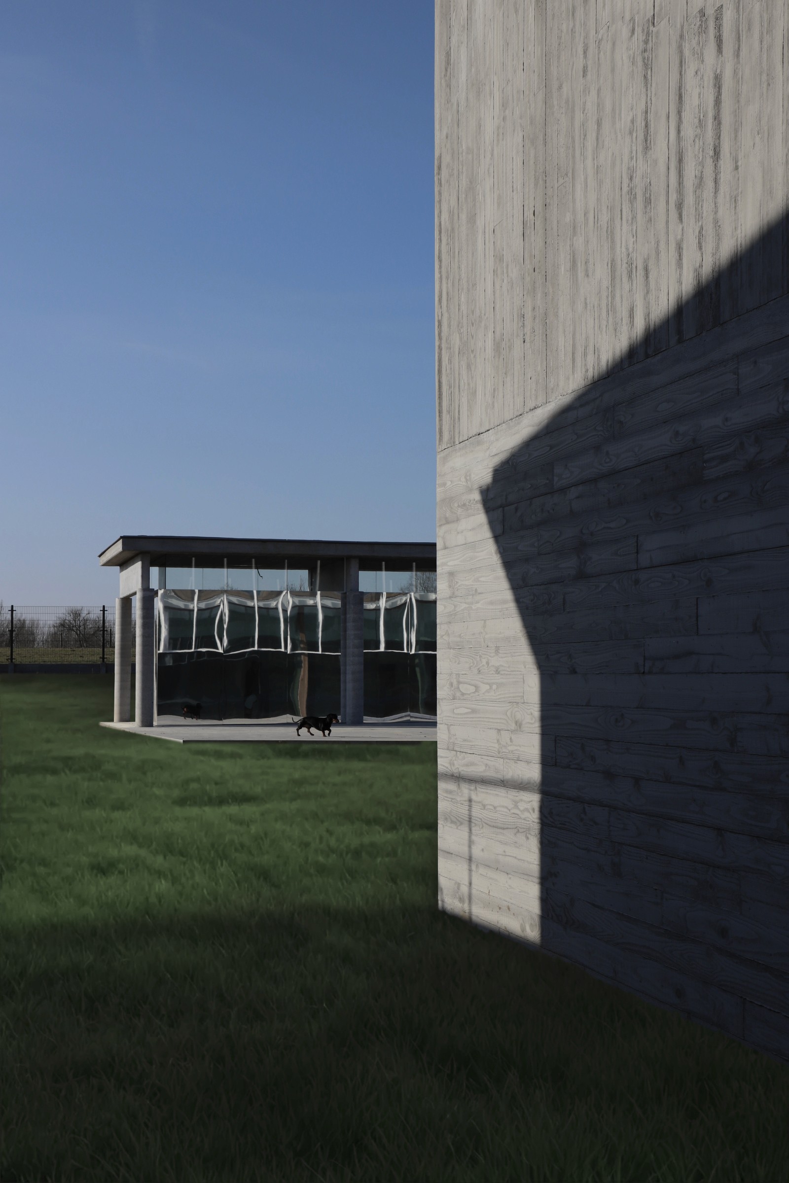 Modernist family home with concrete façade in Erpe-Mere, Belgium, by ODA Architecture