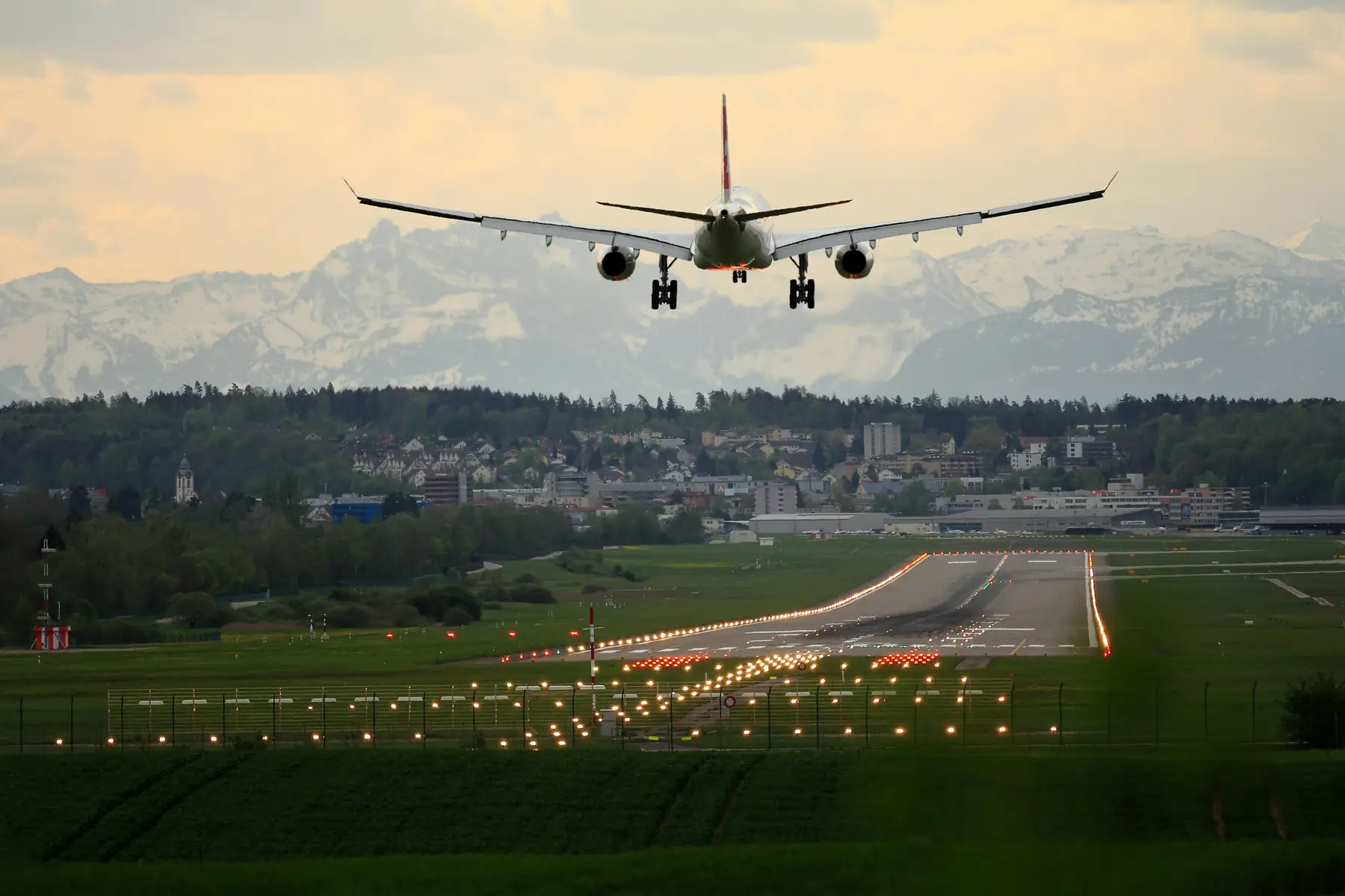 Commercial aircraft landing on a runway representing aircraft remarketing
