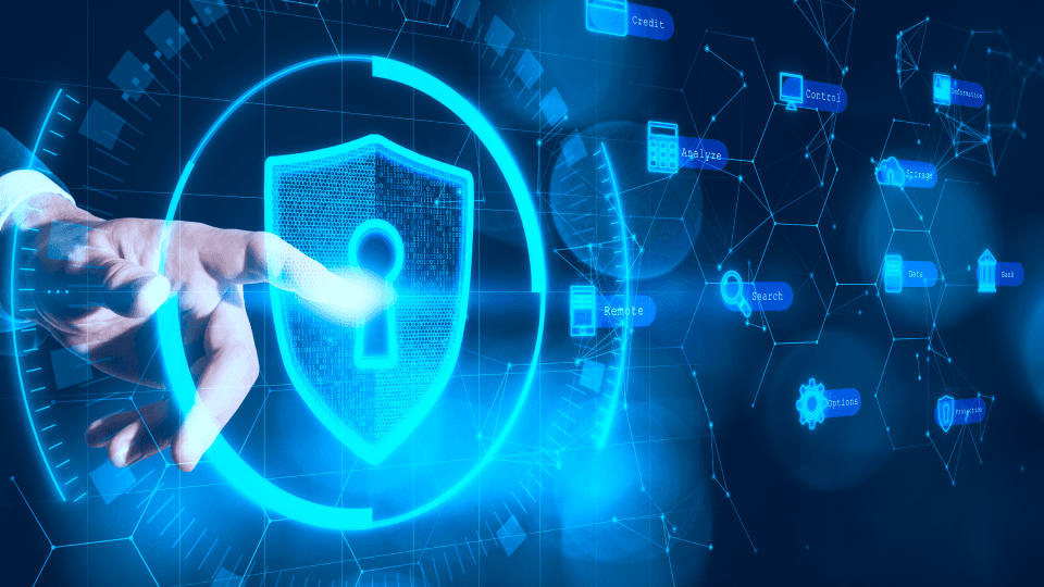 A hand interacting with a digital security shield interface representing cybersecurity.