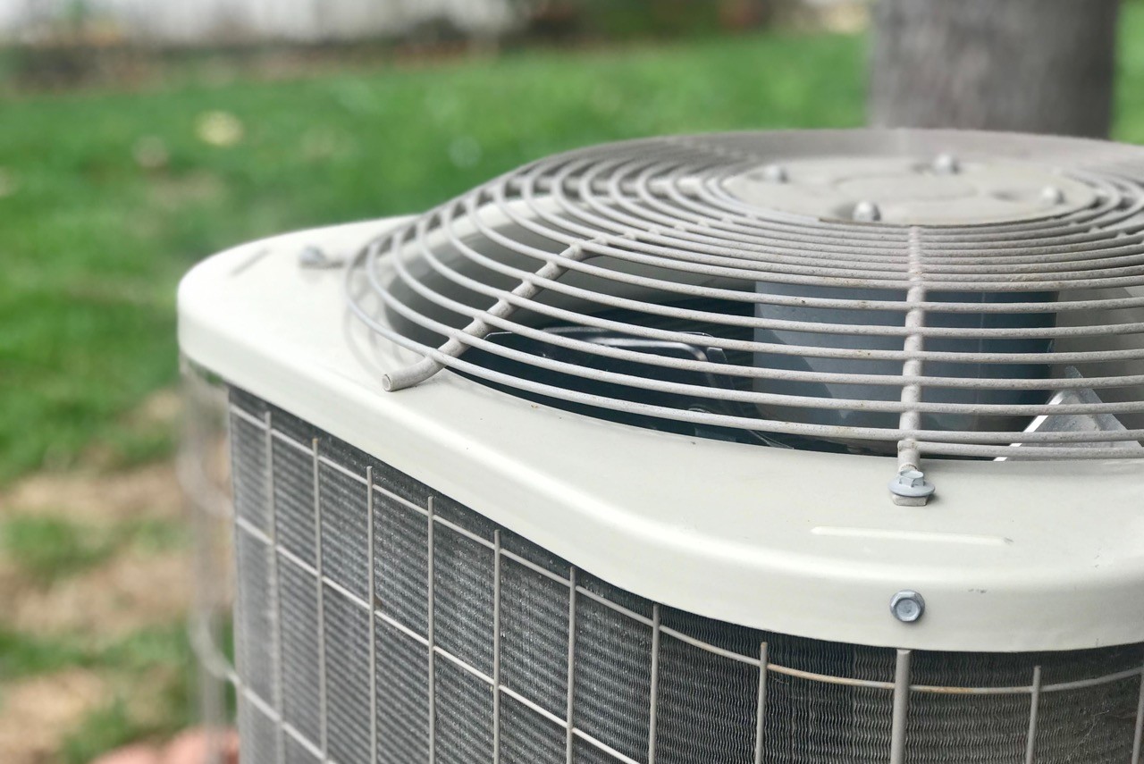 Air conditioning unit mounted on a white wall.