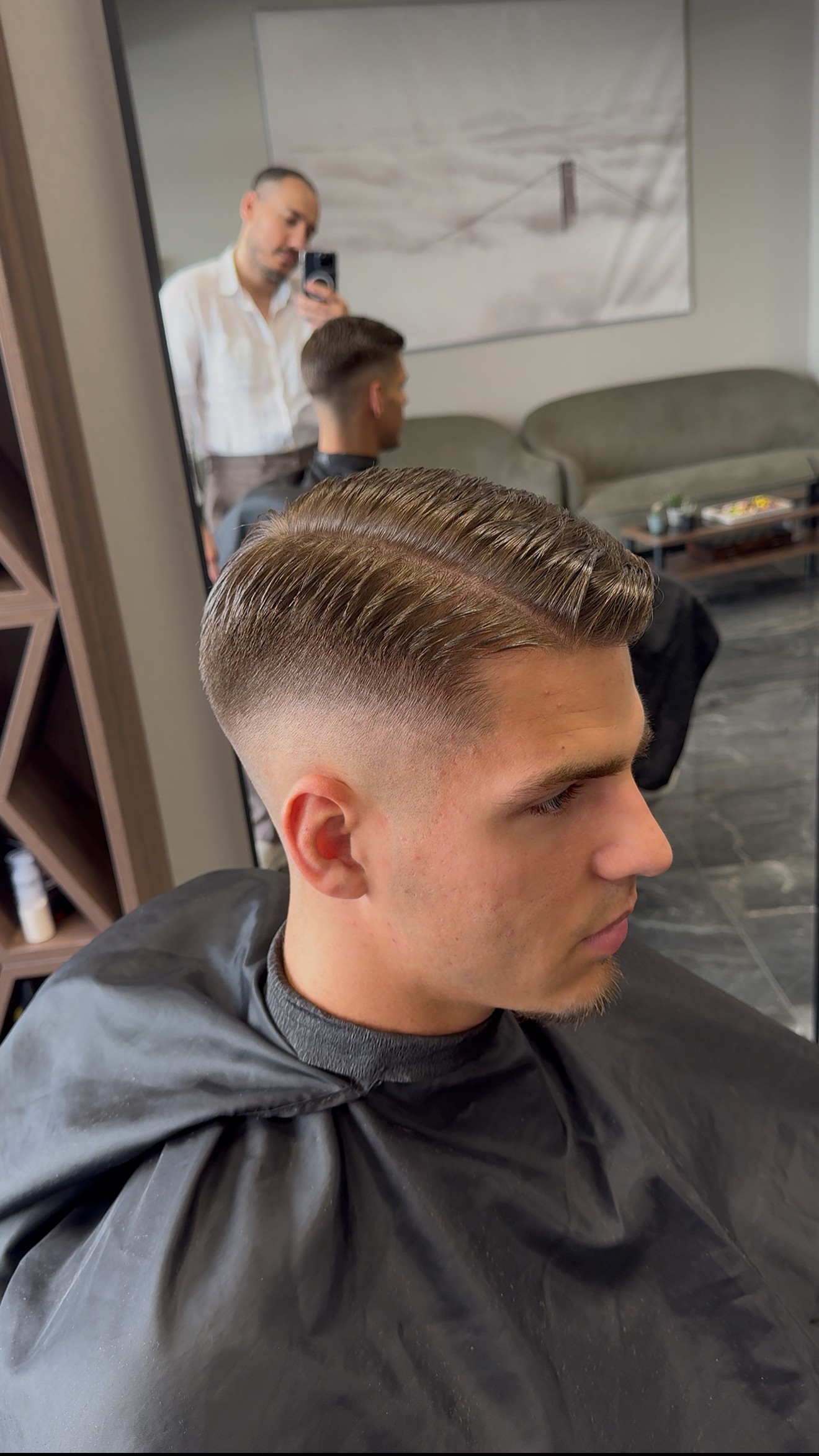 Salon styling station with gold-framed mirrors