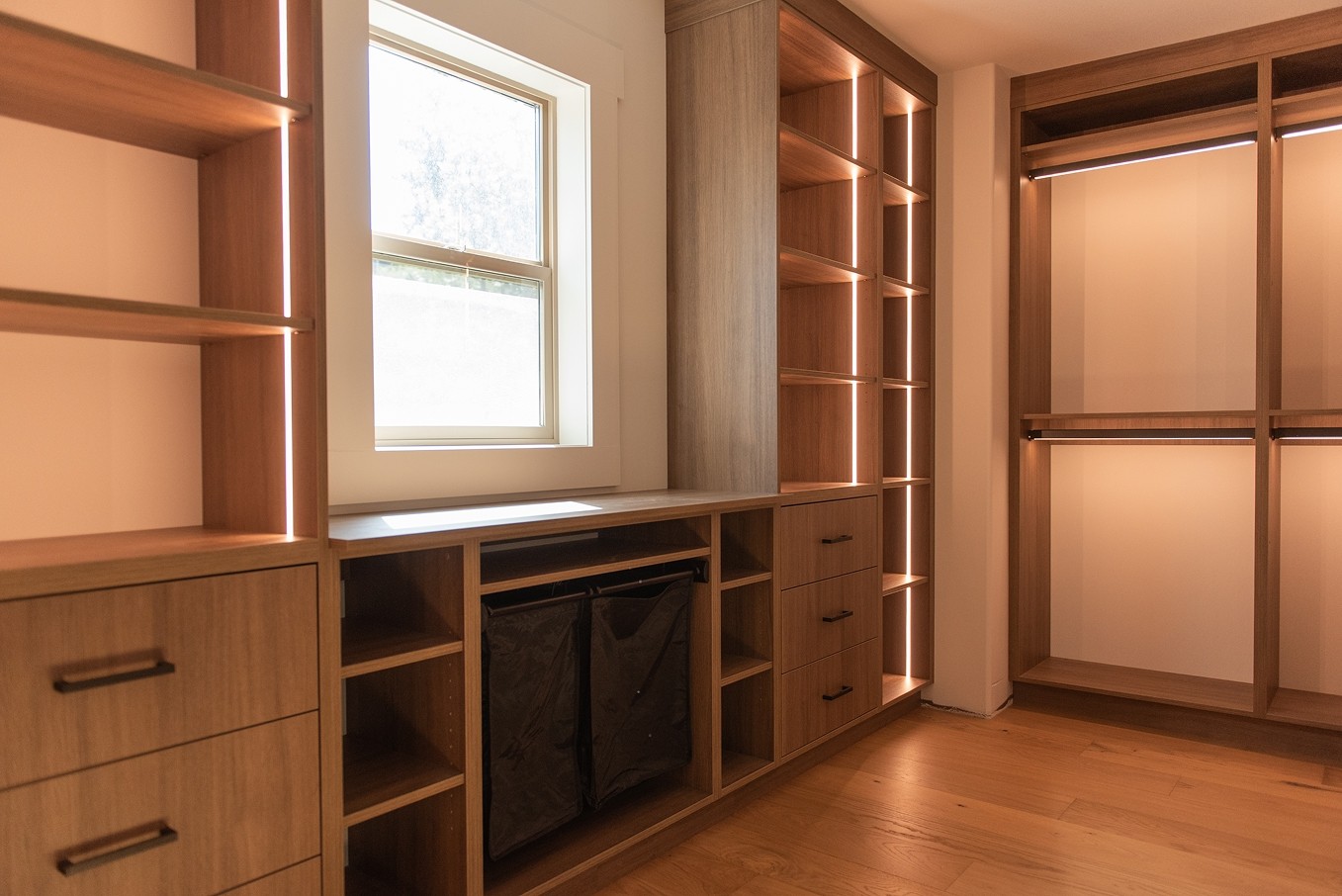 Warm-toned bar cabinetry with integrated lighting