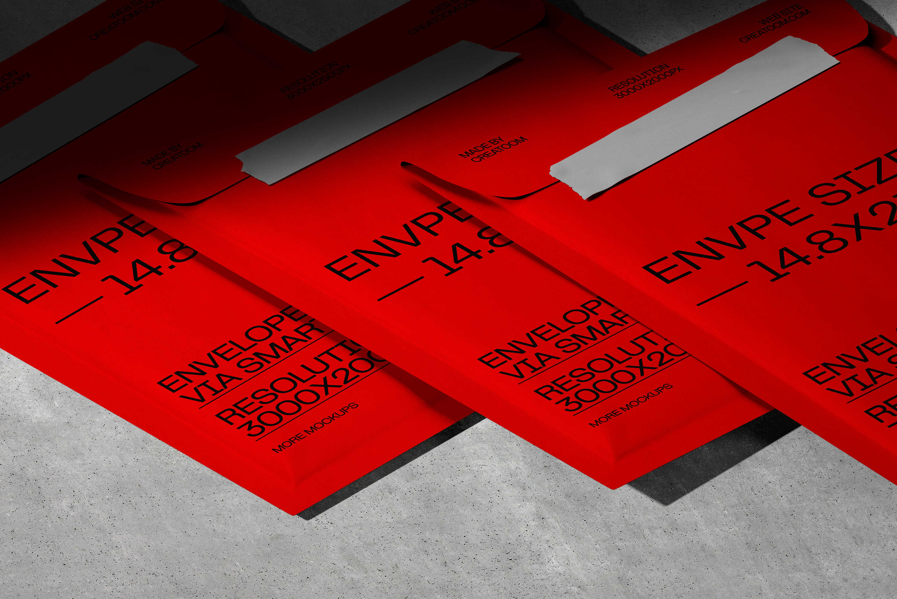Red envelopes with black printed technical labeling on concrete