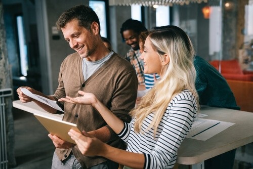 Man and woman looking at paper