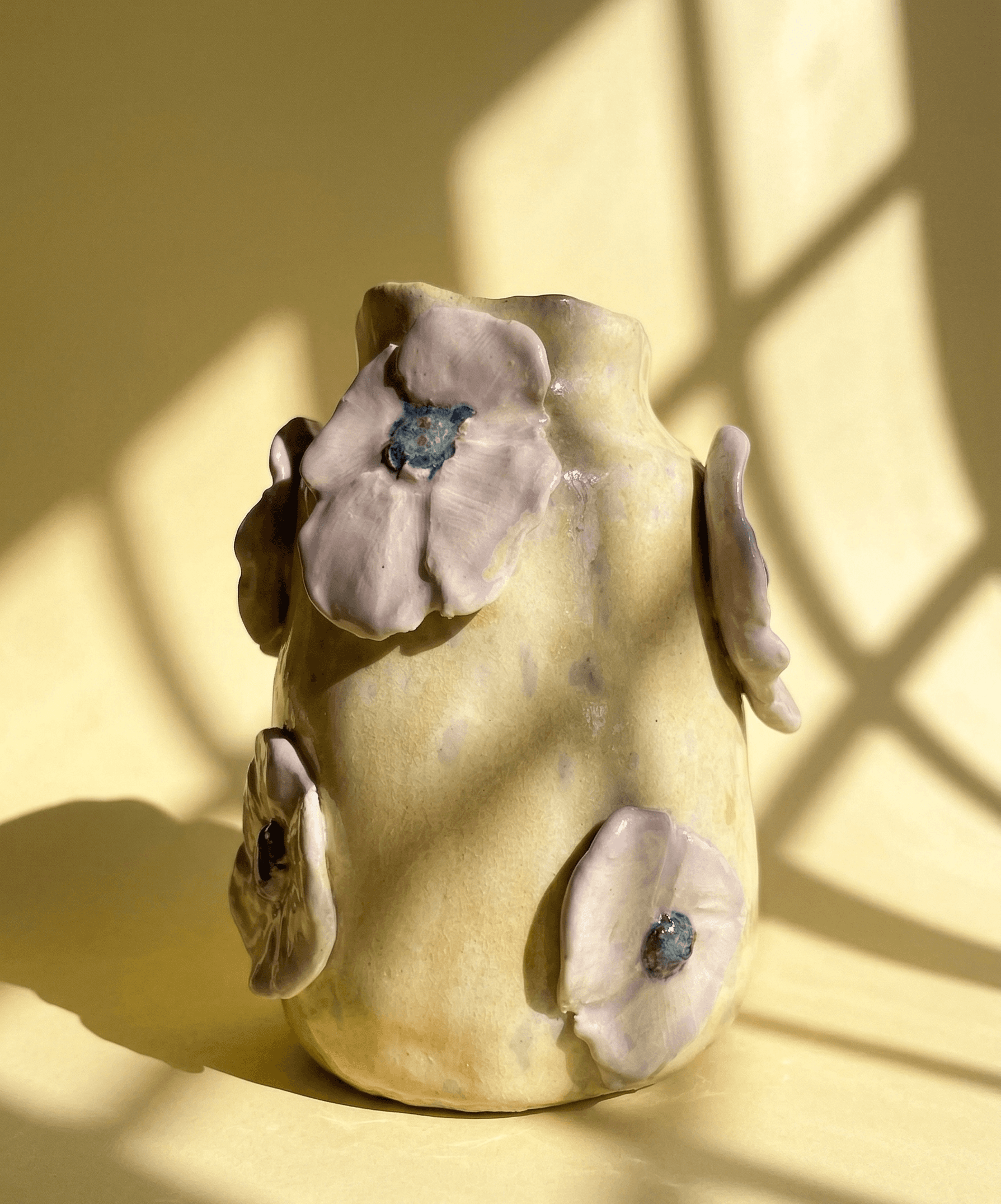 a vase with flower decorations