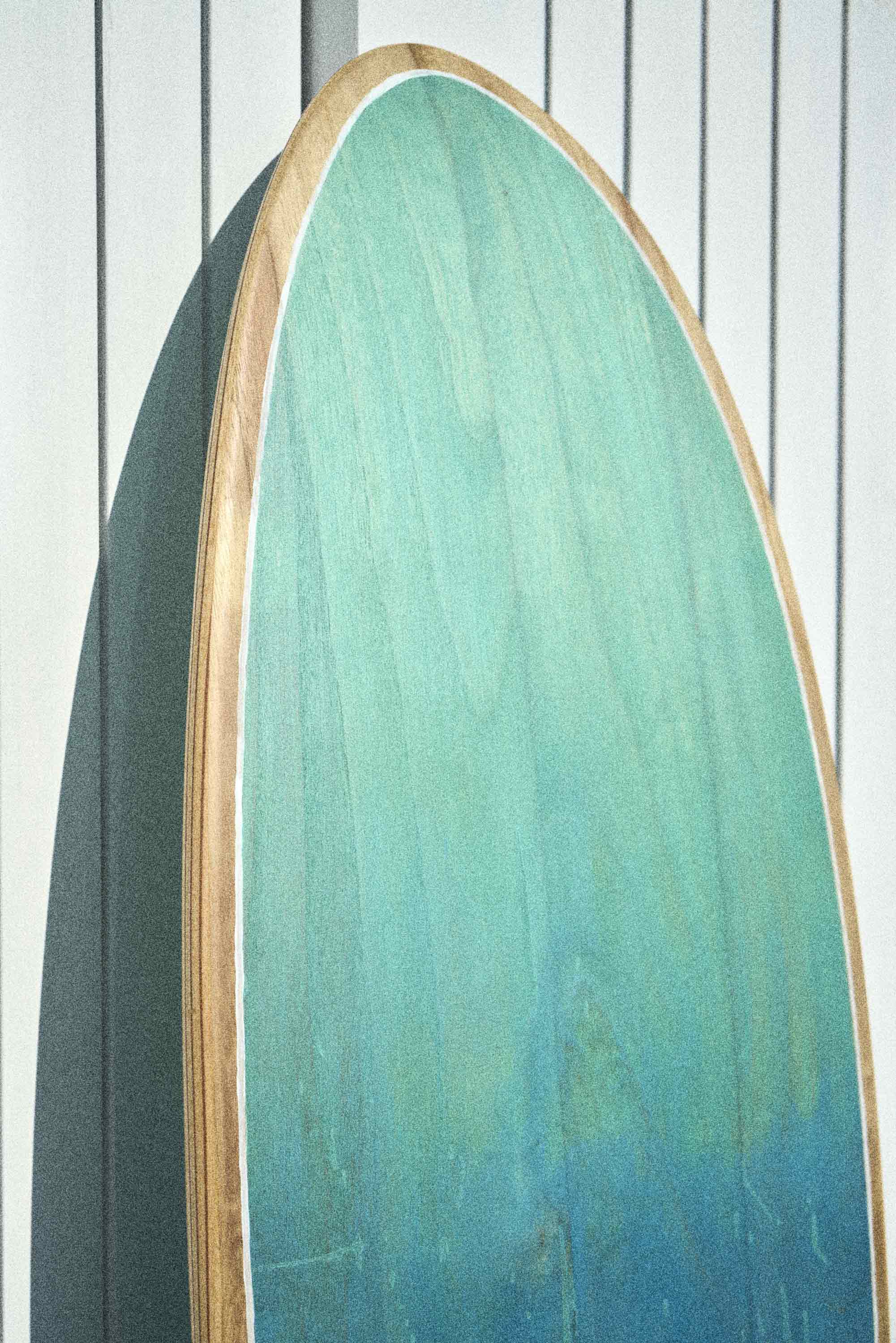 Timber surfboard with green and blue colour