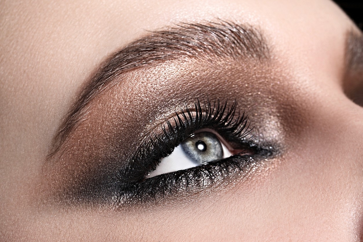 A close up of a woman's eye after cosmetic makeup has been applied