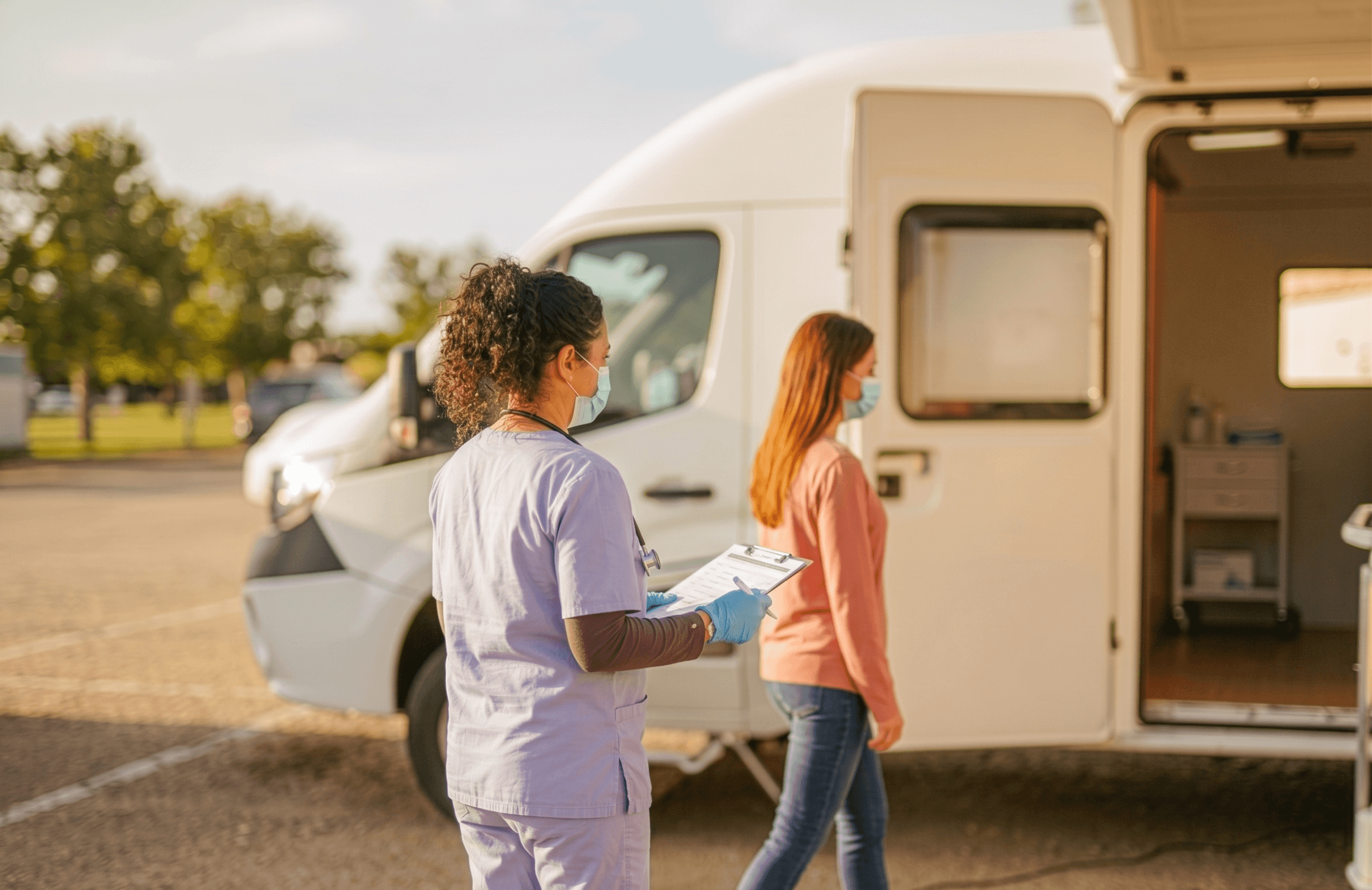 mobile clinic nurse seeing patient