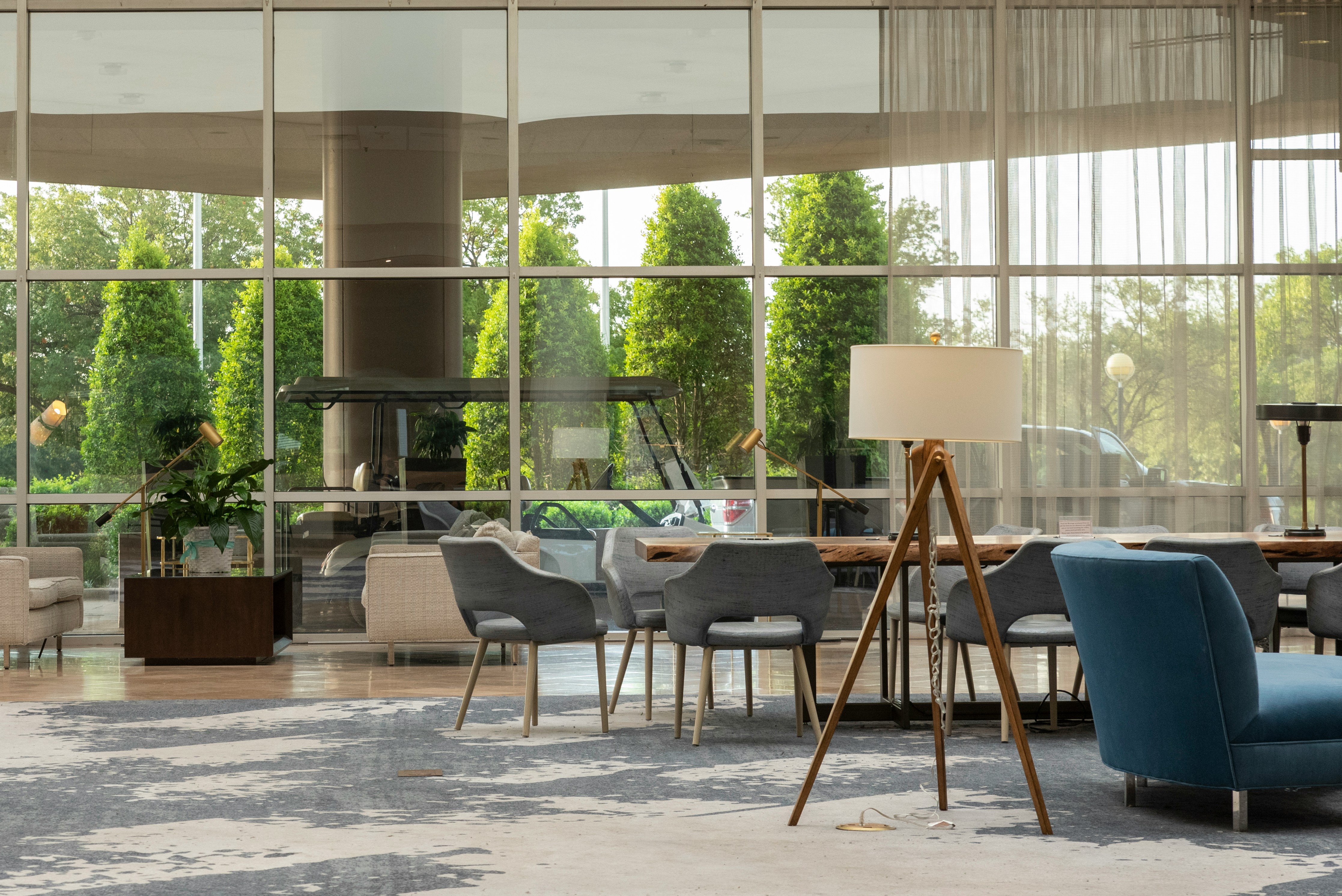 black and gray chairs and table near glass window