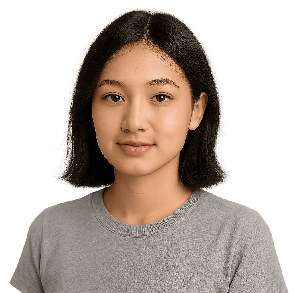 Smiling Asian woman with short black hair wearing a gray t-shirt, looking directly at the camera.