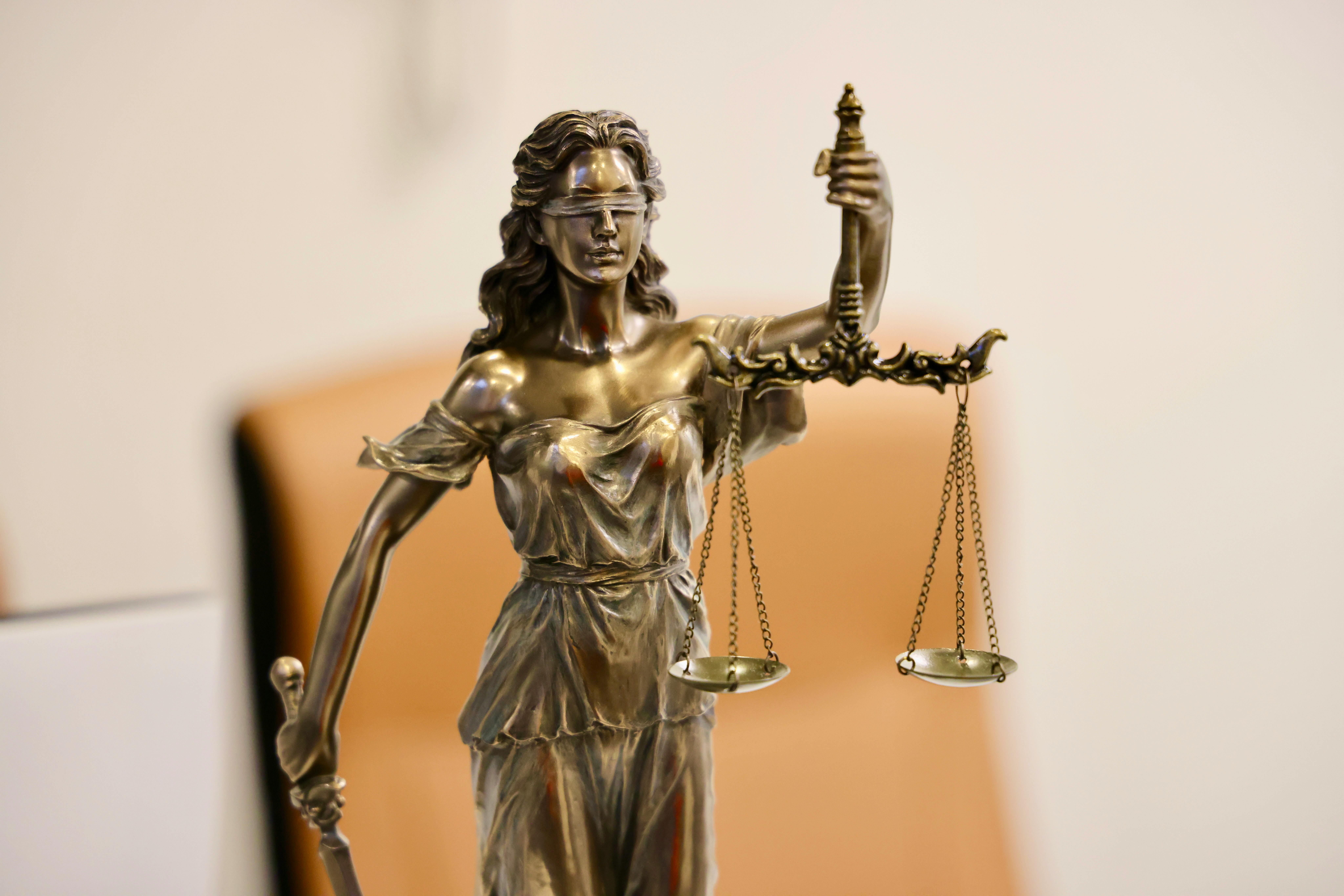 Statue of Justice holding scales and sword