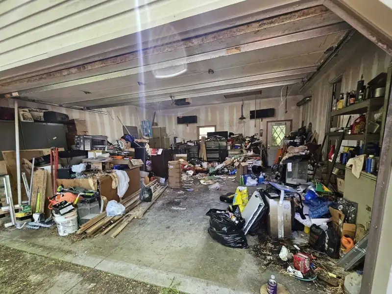 Before: cluttered garage full of junk