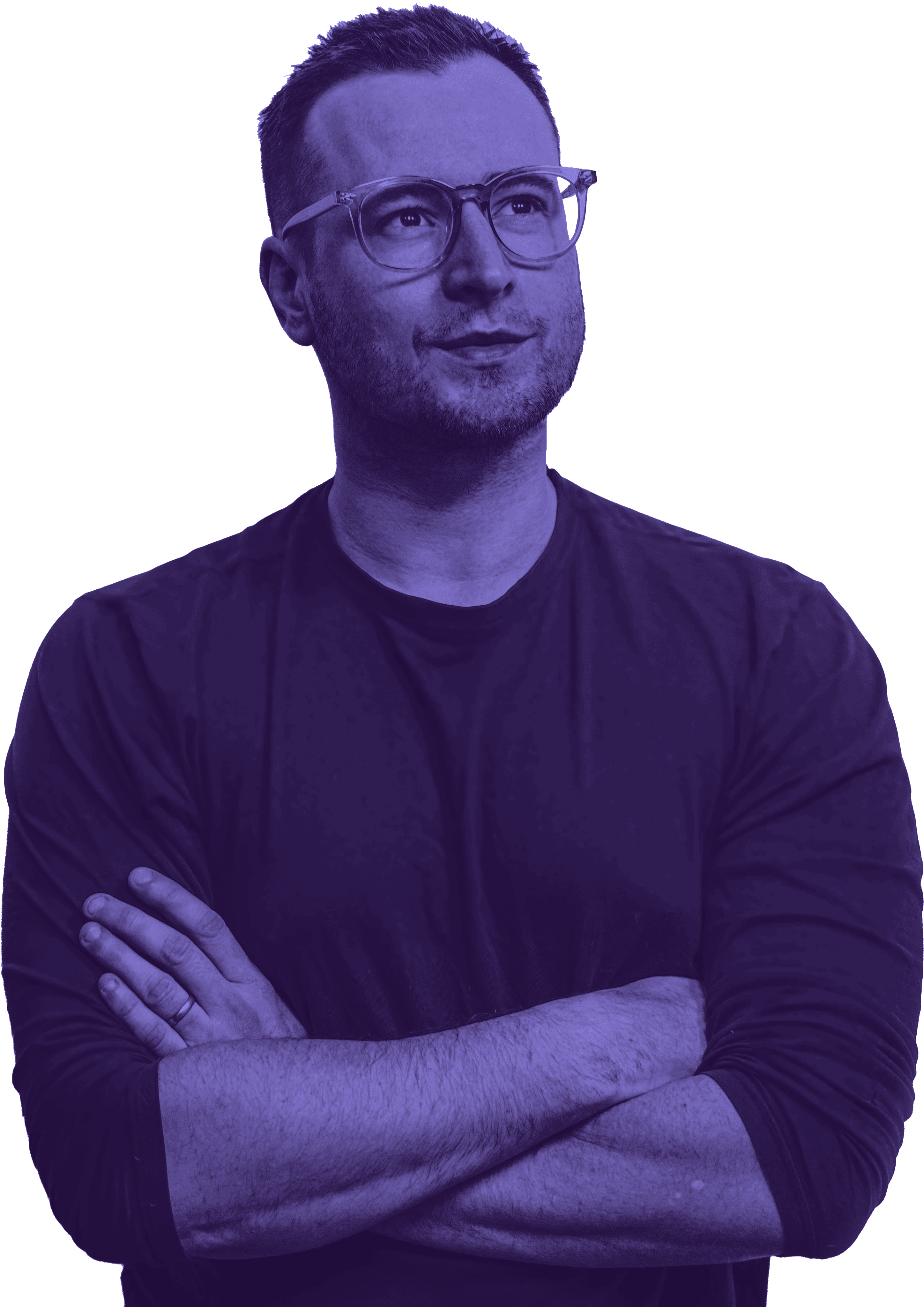 A man wearing glasses and a black shirt stands with his arms crossed, displaying a confident posture.