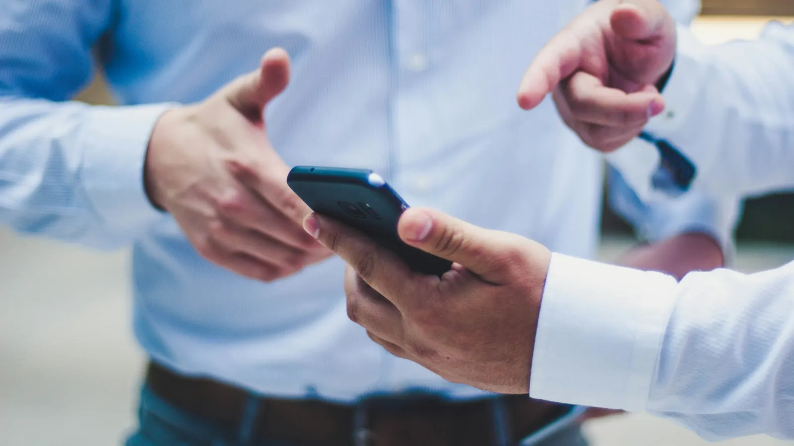 person holding black smartphone