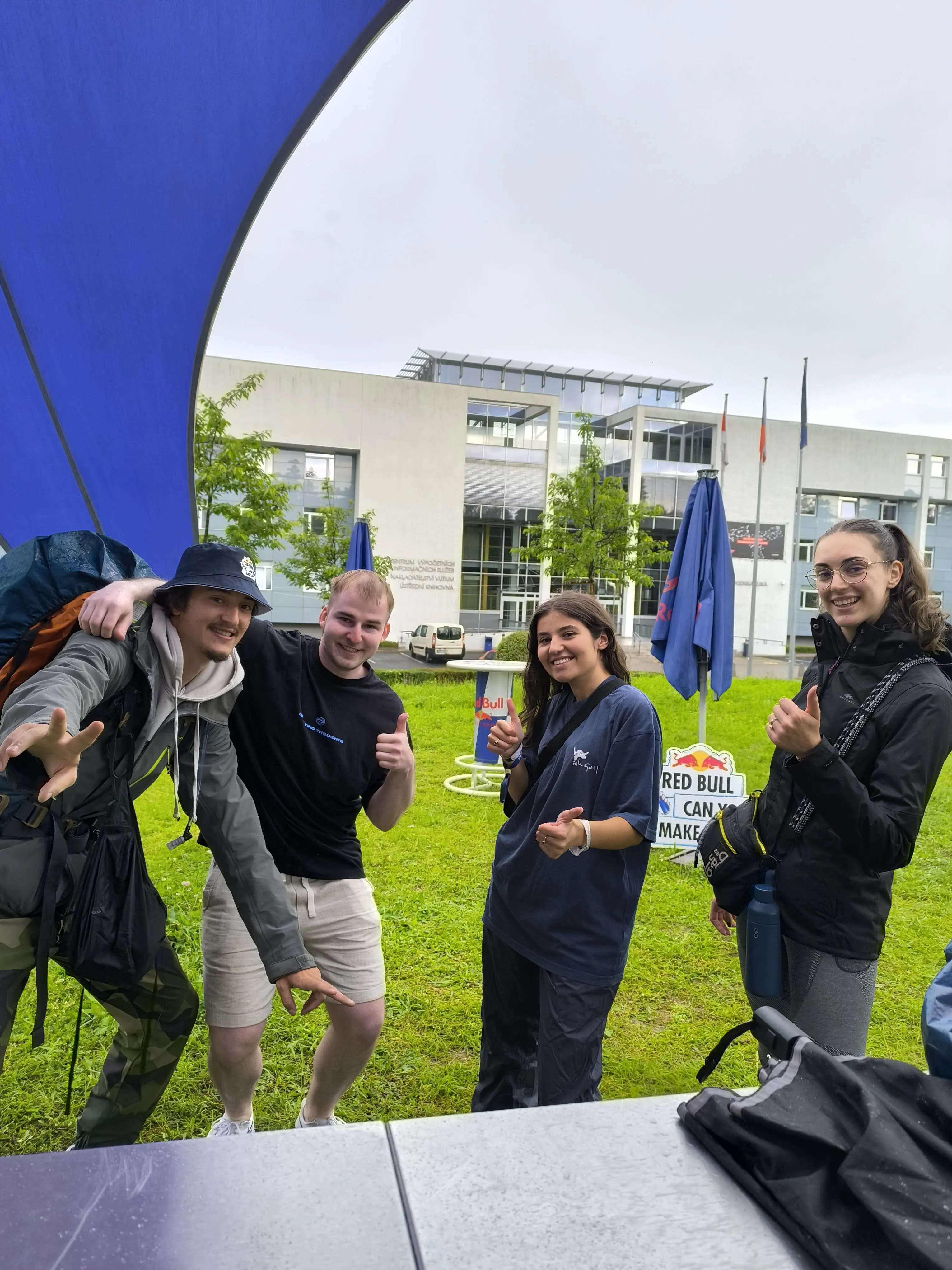 Four people celebrating their arrival at Bruno in the Czech Republic during the Redbull challenge