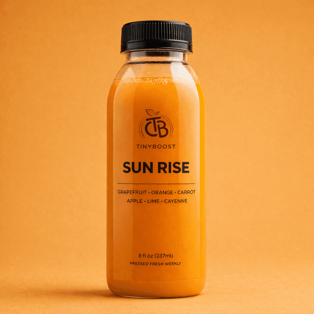Sun Rise orange cold-pressed juice bottle by TinyBoost.