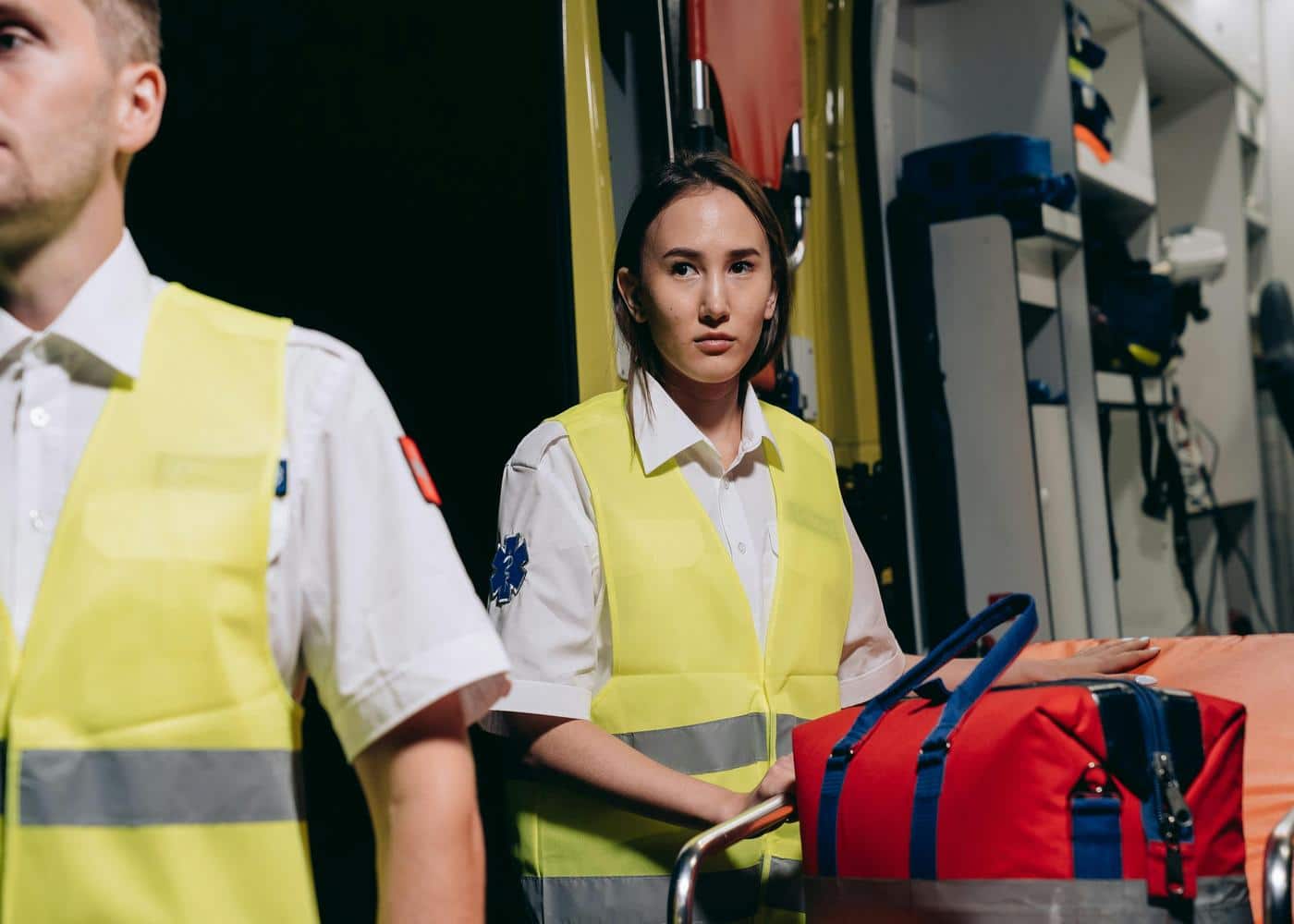 Two paramedics in an ambulance working the night shift