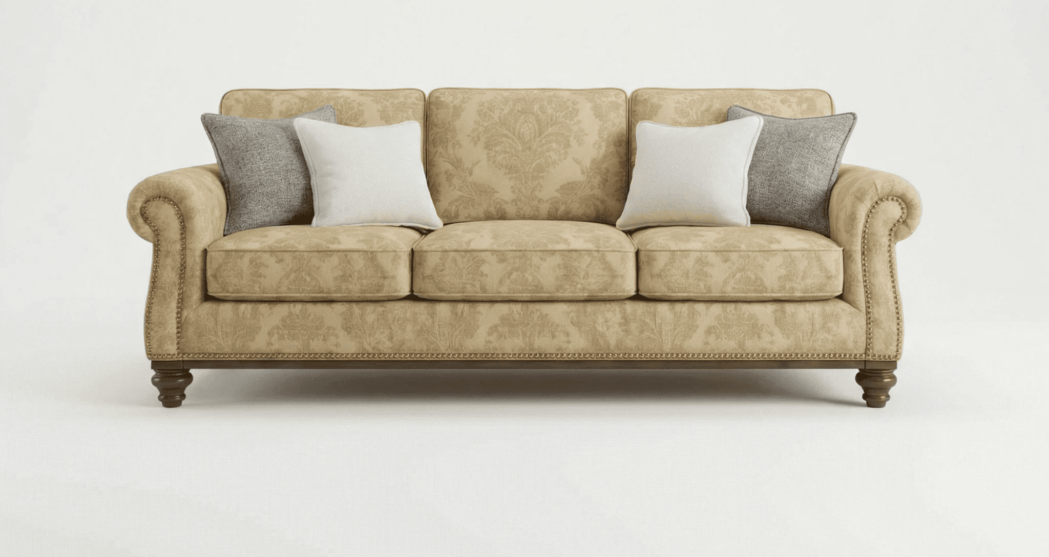 Three‑seater beige upholstered sofa with rolled arms, patterned fabric, and wooden legs