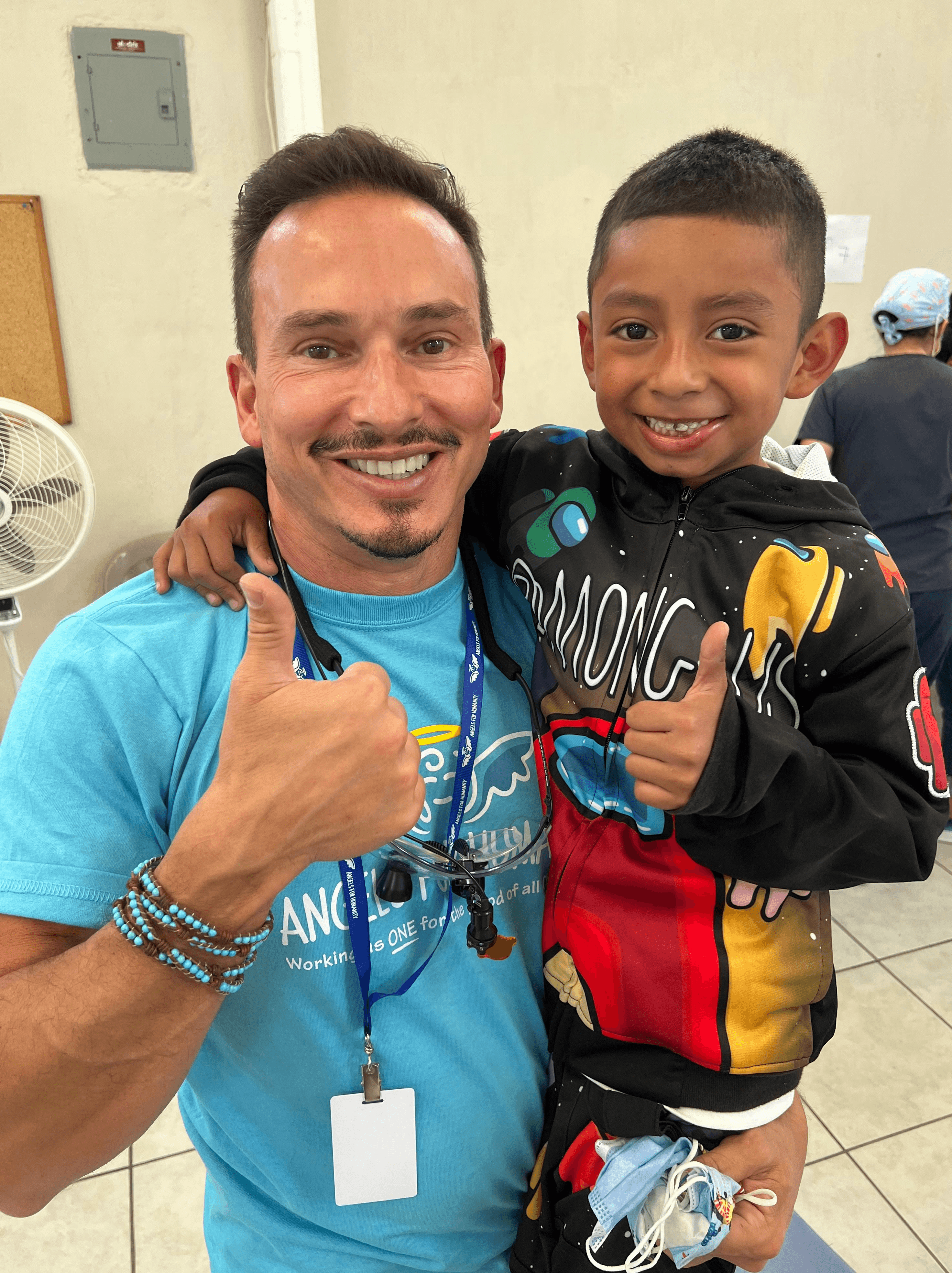 a person and a boy posing for a picture