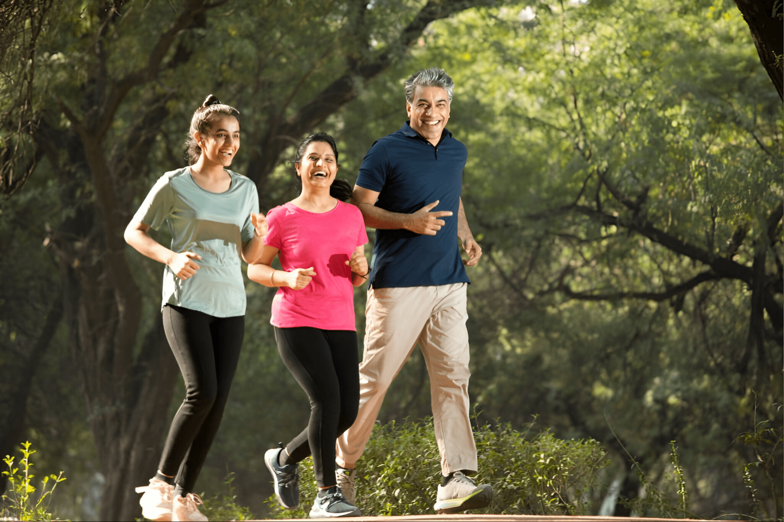 Indian family jogging together in a park for healthy lifestyle