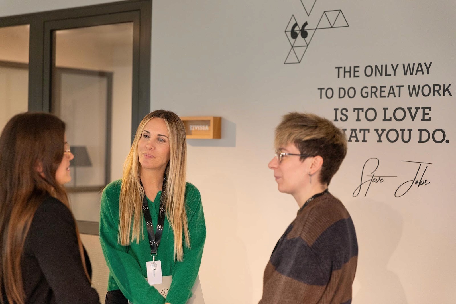 CEO of the BeToken is having a discussion with her colleagues in the office