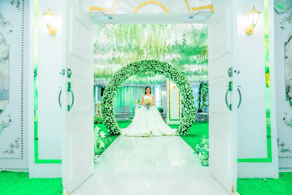 Bride framed by the grand ivory doorway of Celestia Hall, Stalla Suites Events Place