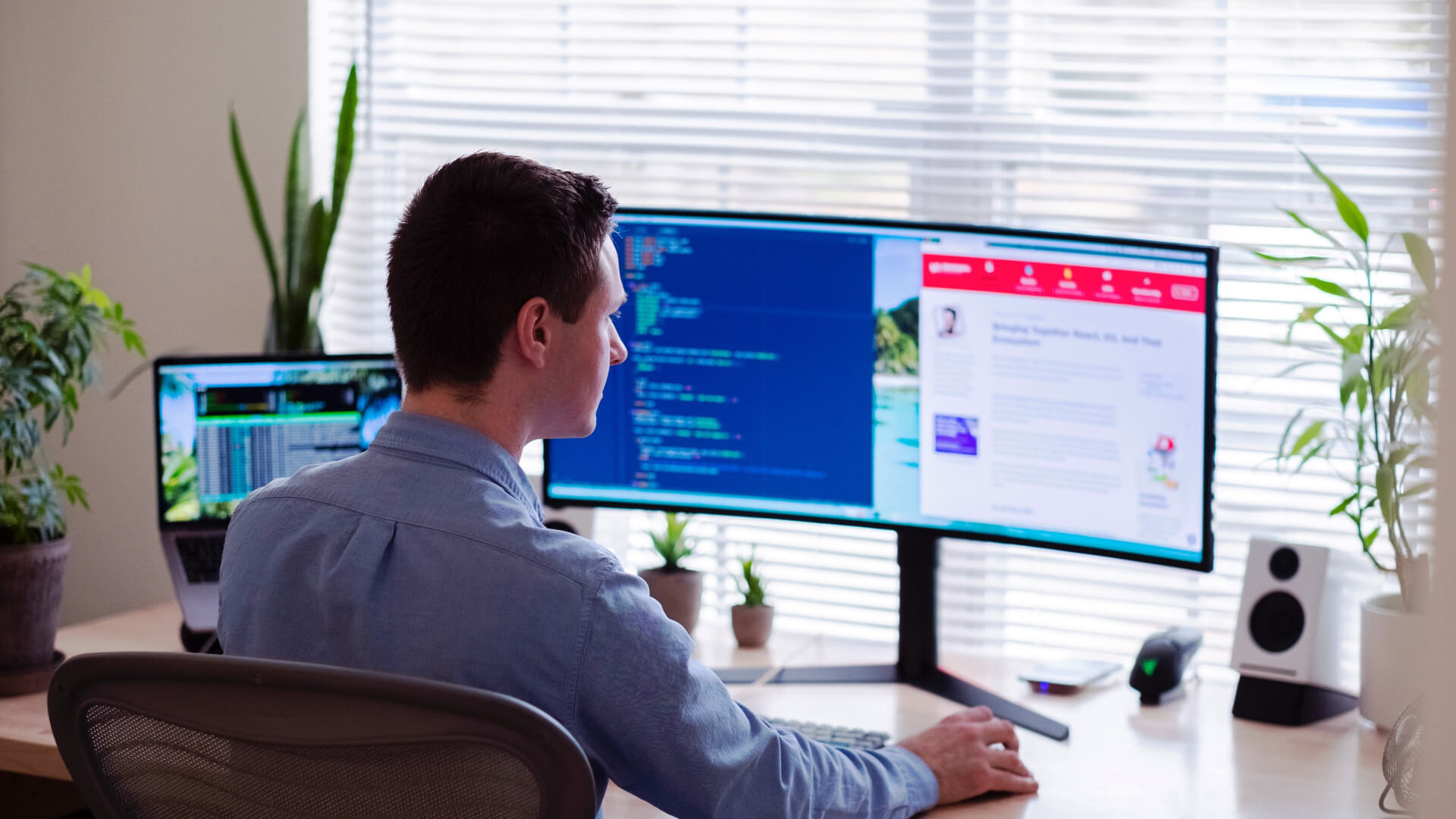 Man sitting looking at a computer screen