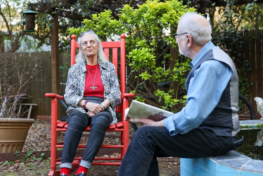 Bubjan with book and speaking to camera