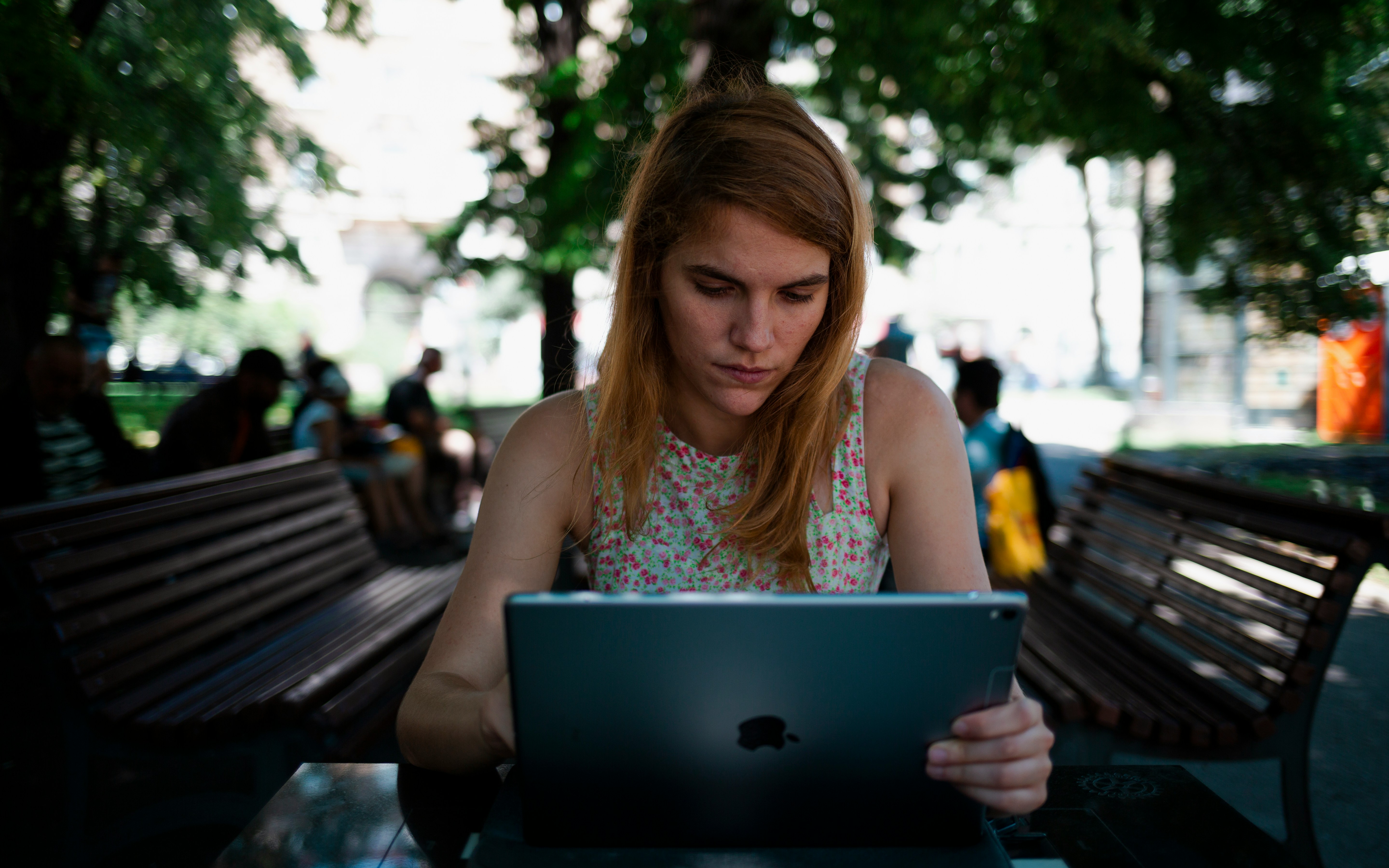 woman sitting outdoor trying to Excel Categorize Data