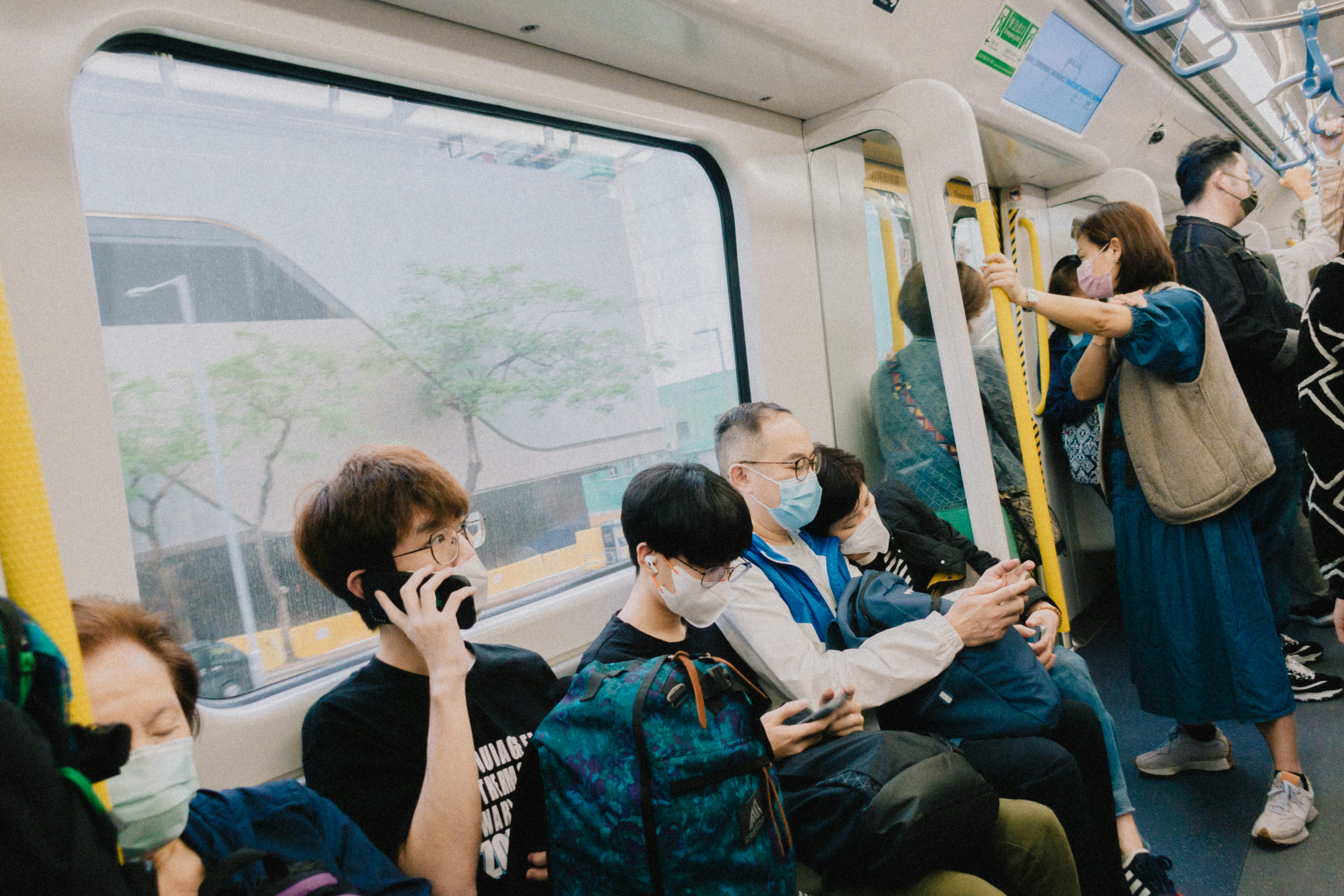 group of people sitting on the train in Japan