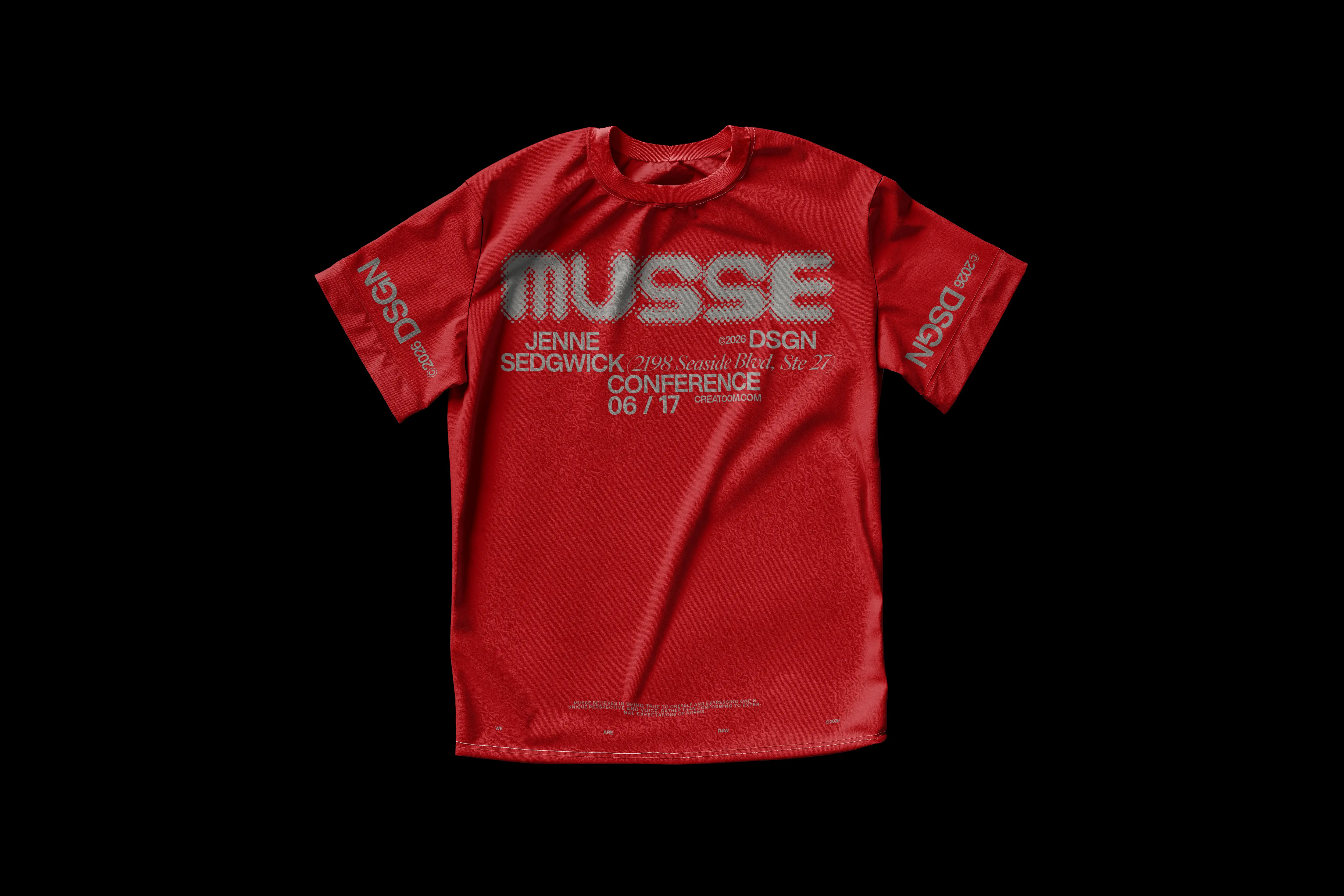 Red Musse t-shirt laid flat on a dark background