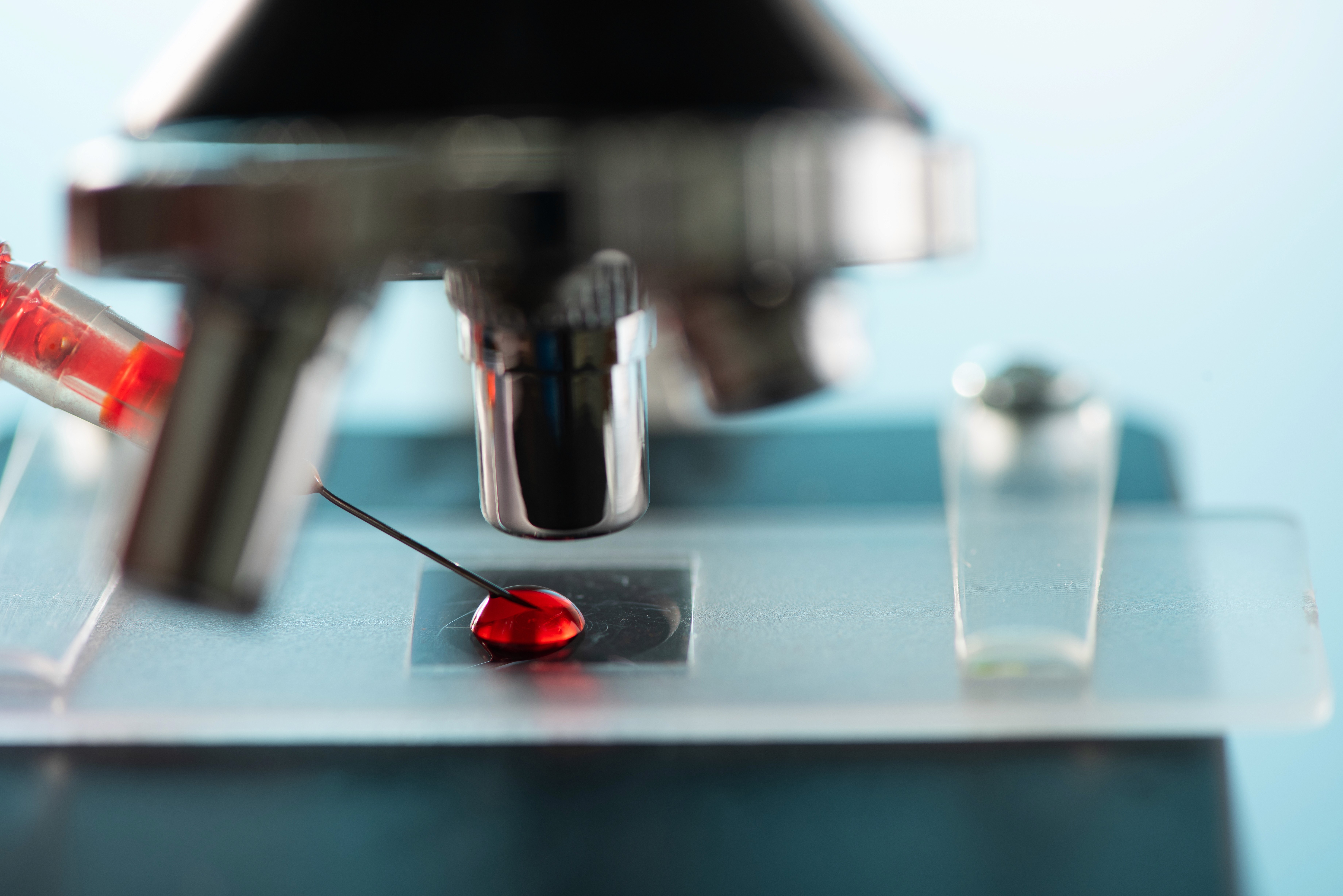a man wearing a hat and holding a green object
