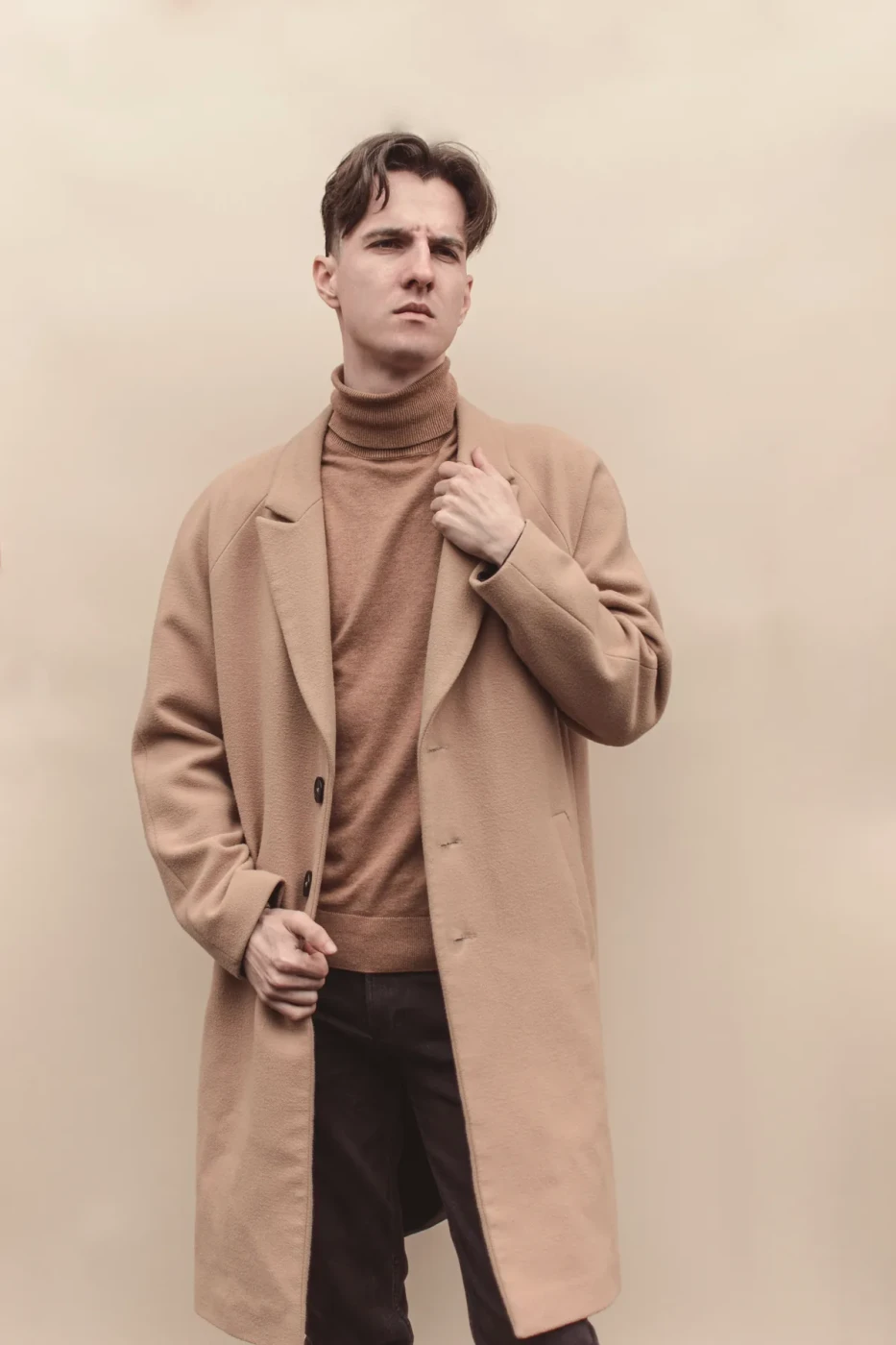 Camel overcoat over a roll-neck