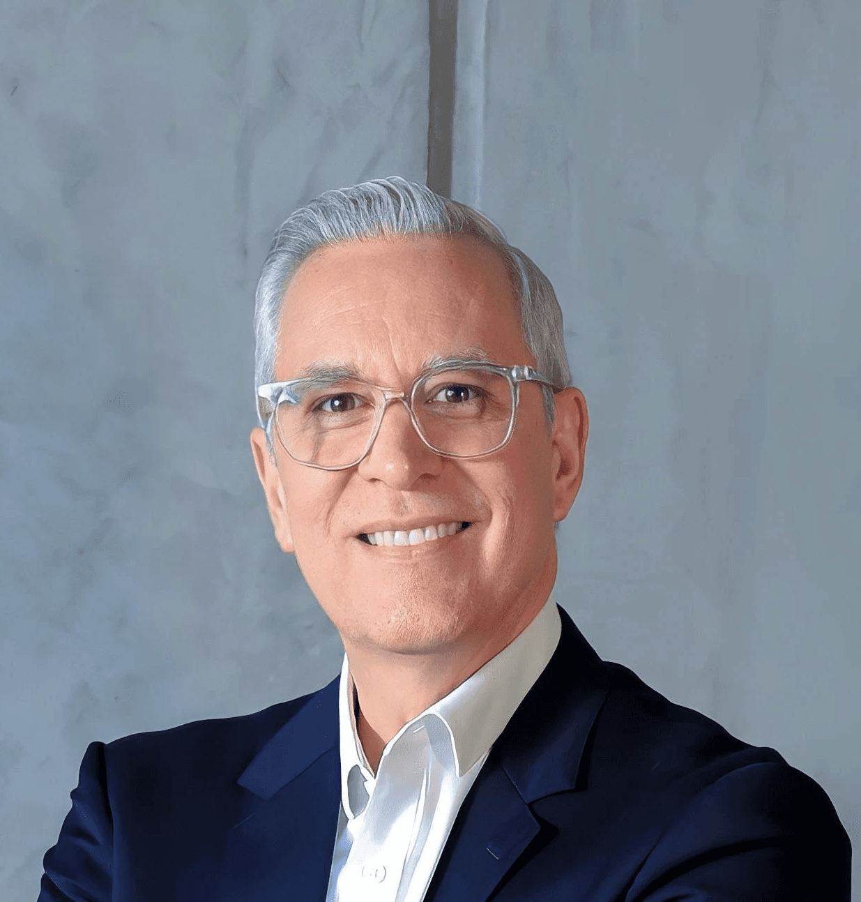 a man in a suit and tie posing for a picture