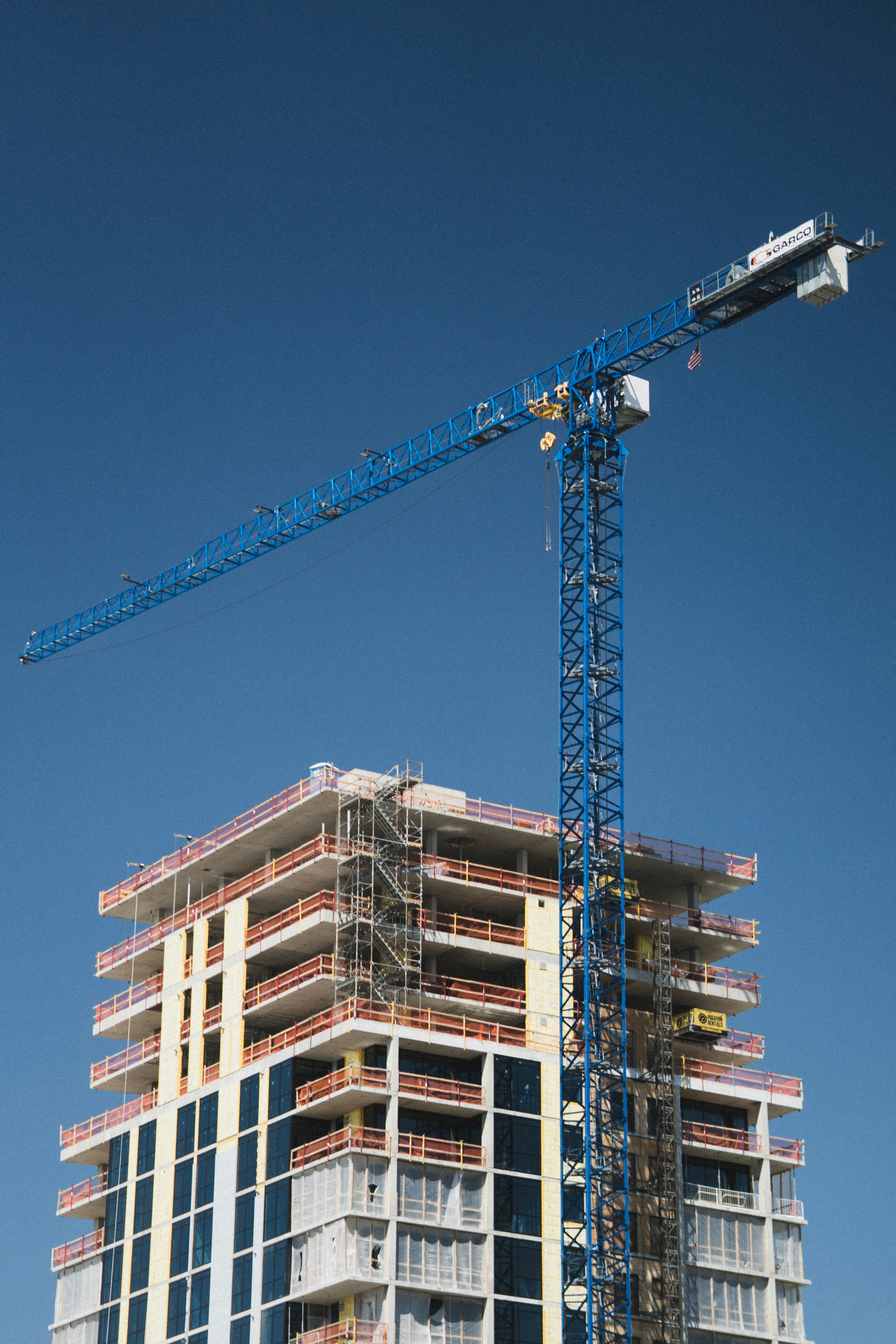Construction of a tall building with a crane.