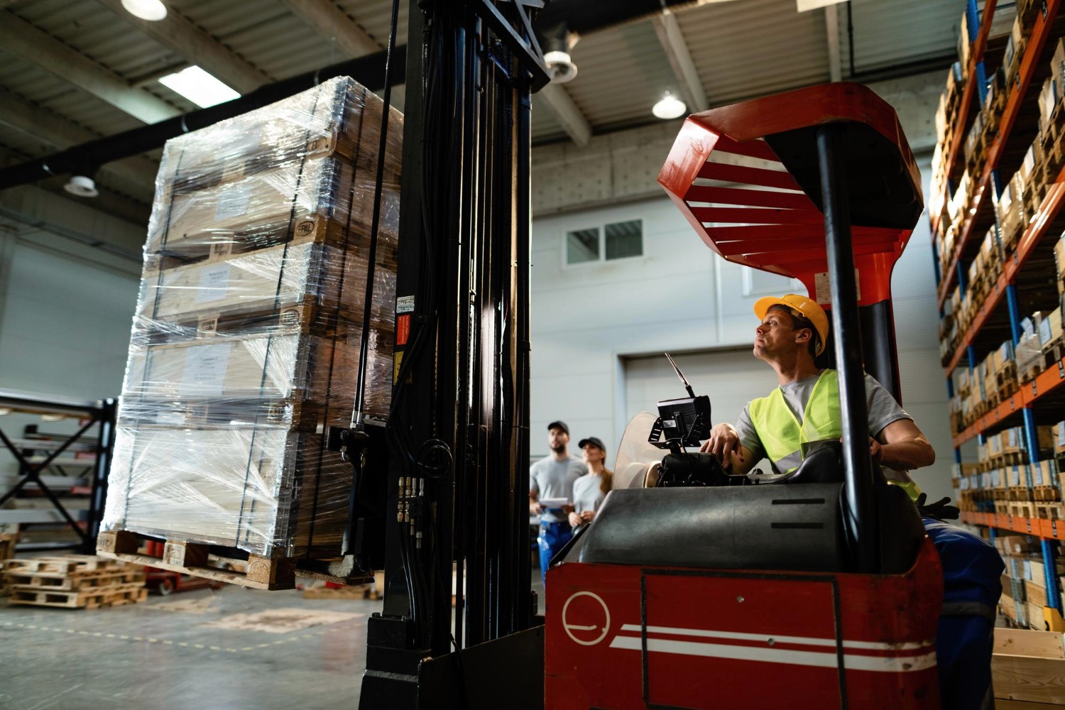 Warehouse team handling parcels during logistics operations
