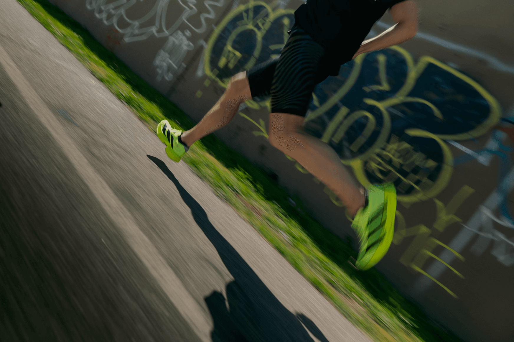 Runner in motion on a road, dynamic angle with motion blur