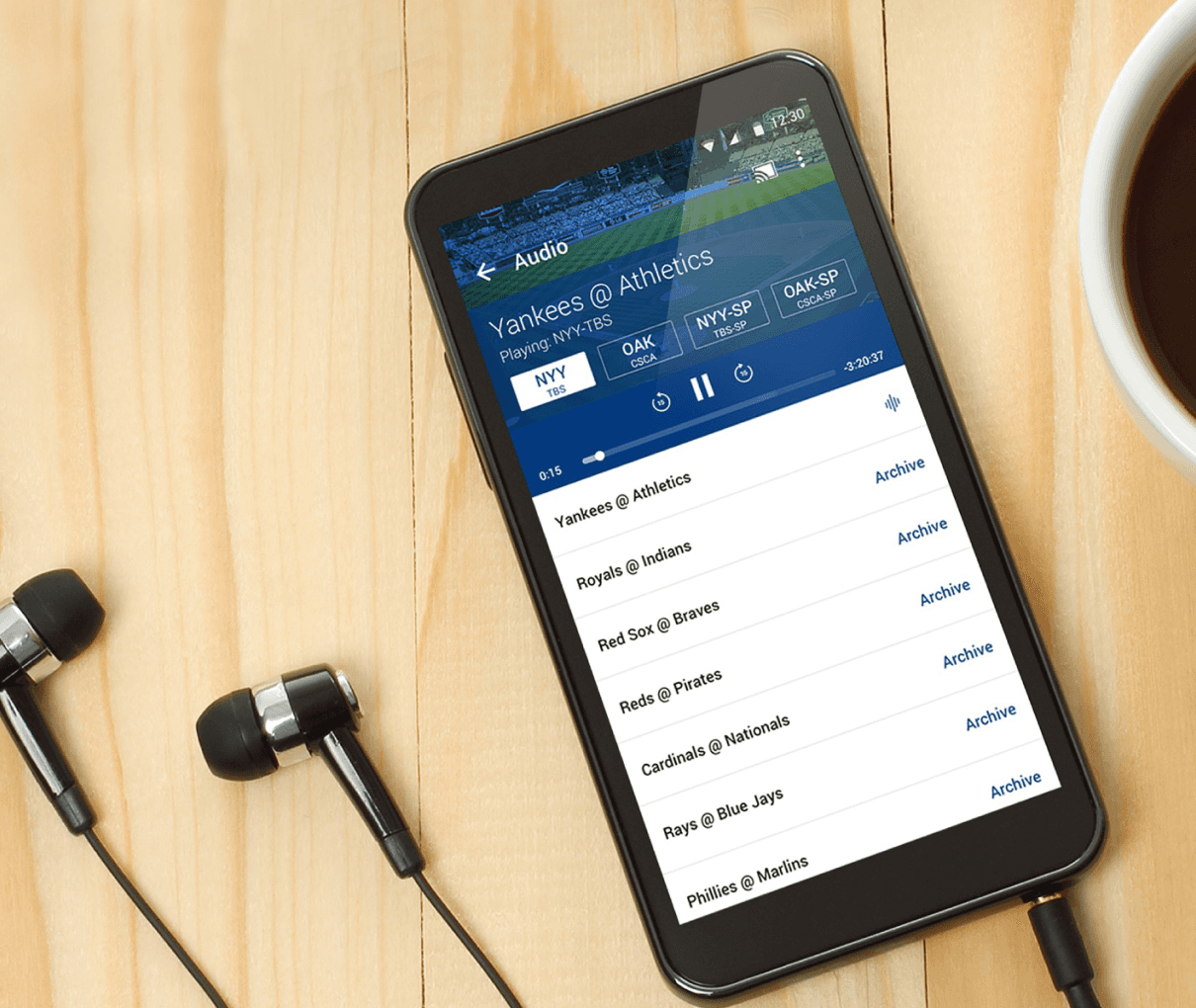 MLB At Bat app audio listening with coffee and headphones